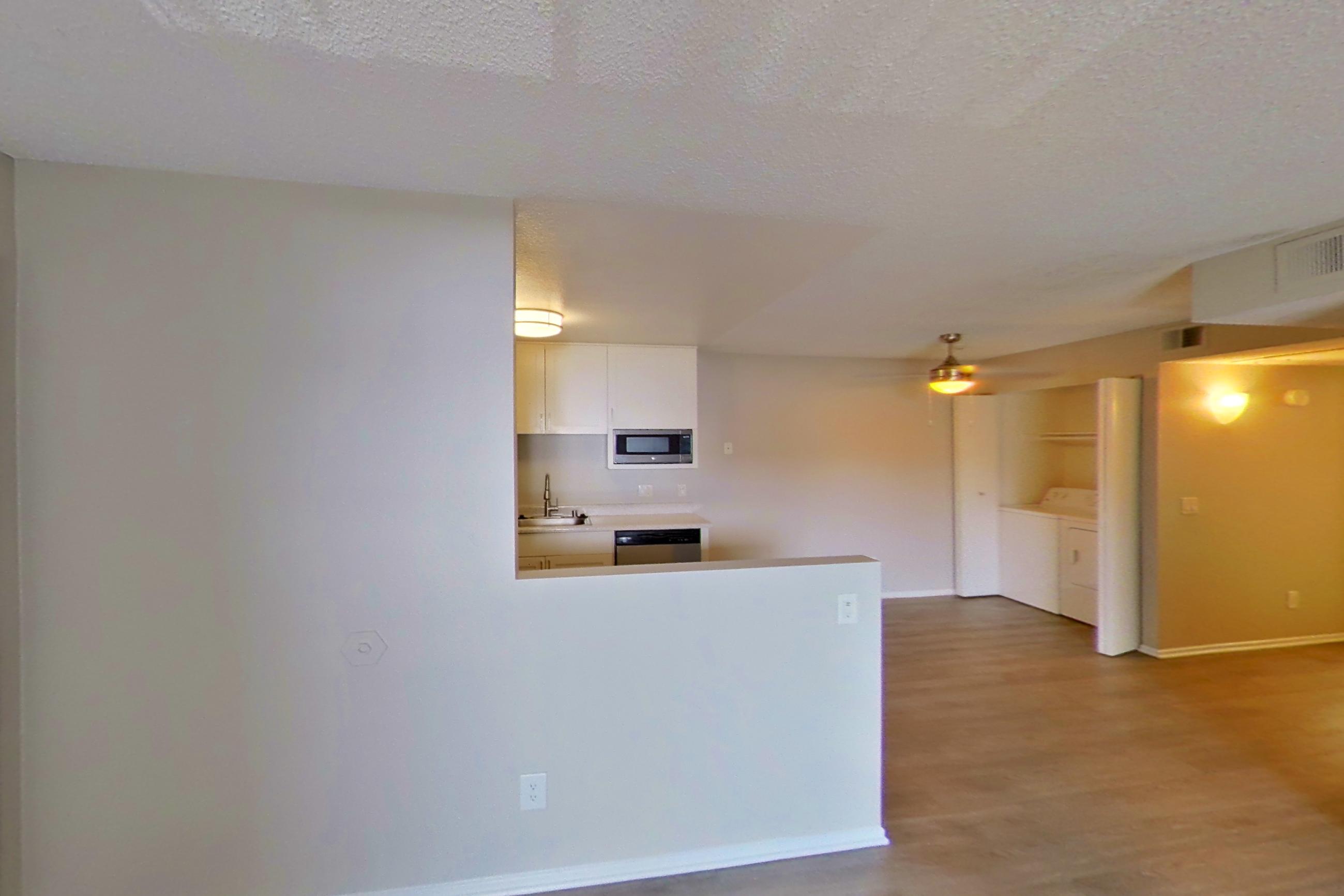 Living space with dishwasher and stainless steel appliances, Apartment 04-07 at Avana Rancho Cucamonga