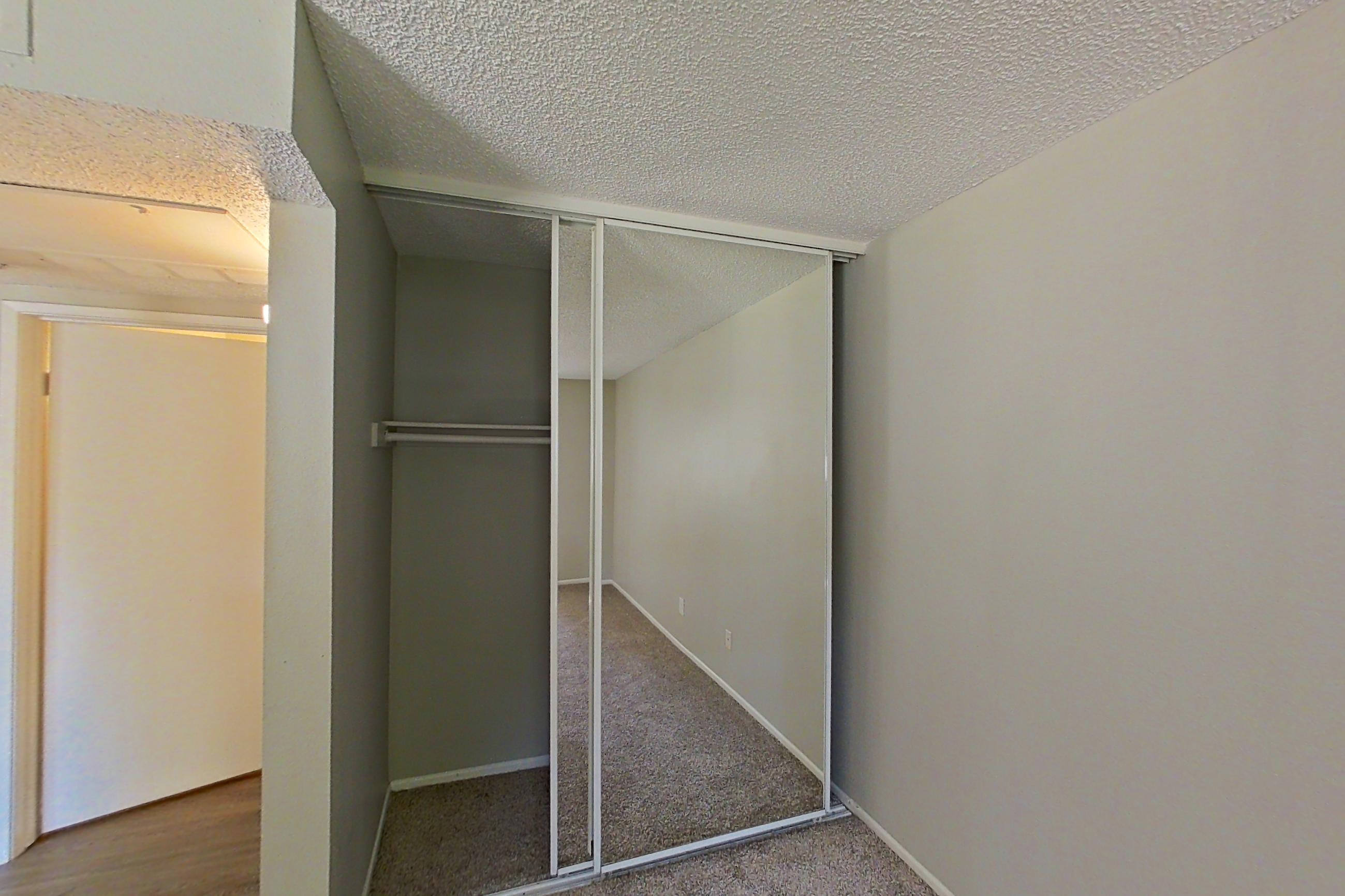 Living space with light carpet, Apartment 10-04 at Avana Rancho Cucamonga