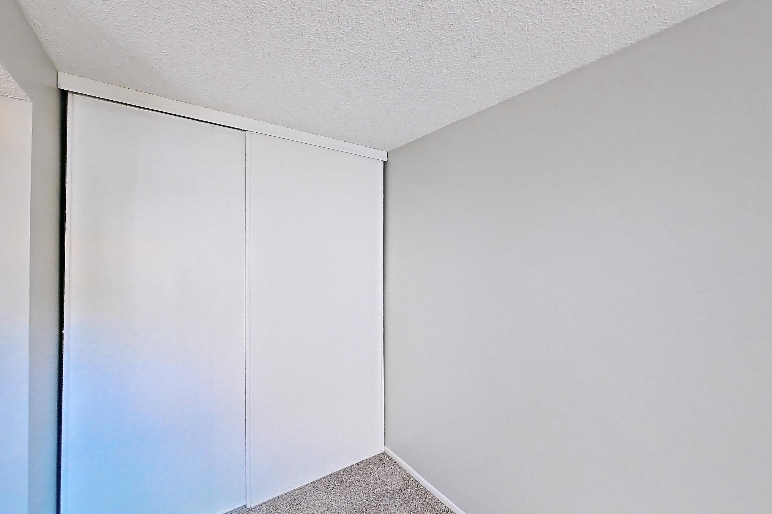 Living space with light carpet, Apartment 12-08 at Avana Rancho Cucamonga