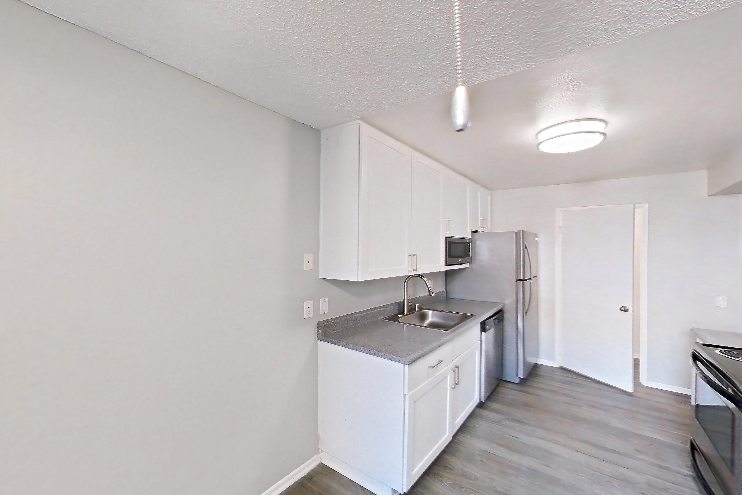 Dining area with dishwasher, electric range, oven/range, and stainless steel appliances, Apartment 13-05 at Avana Rancho Cucamonga