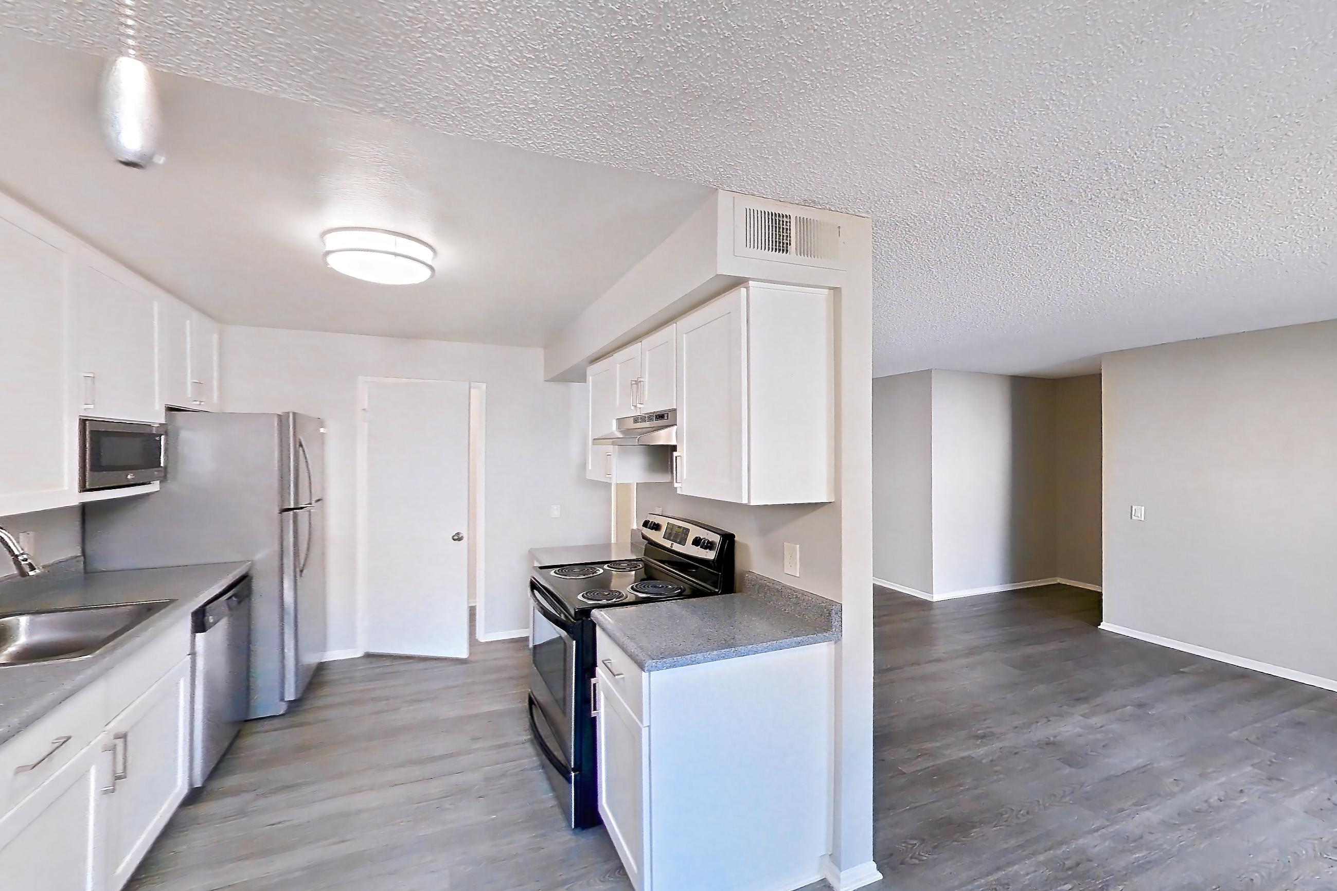 Dining area with dishwasher, electric range, oven/range, and stainless steel appliances, Apartment 13-05 at Avana Rancho Cucamonga