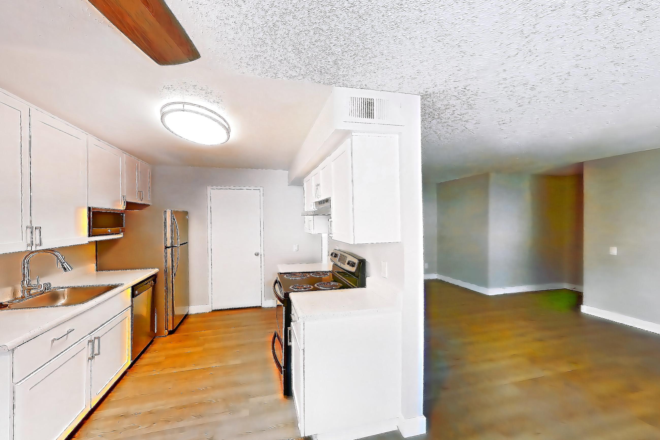 Dining room with dark wood-finish flooring, electric range, light countertops, light wood-finish flooring, and oven/range, Apartment 17-01 at Avana Rancho Cucamonga