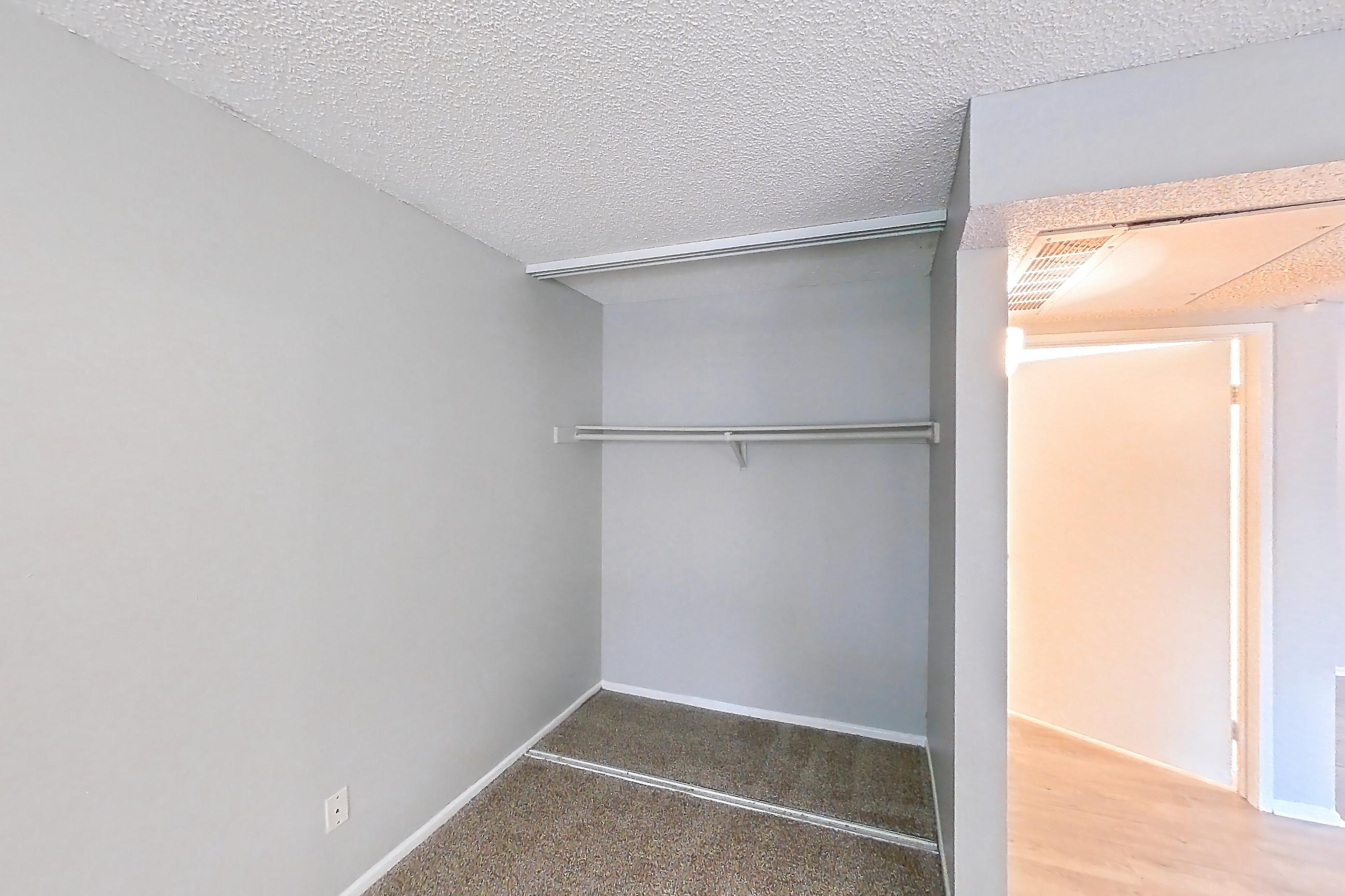 Living space with light carpet, Apartment 10-06 at Avana Rancho Cucamonga