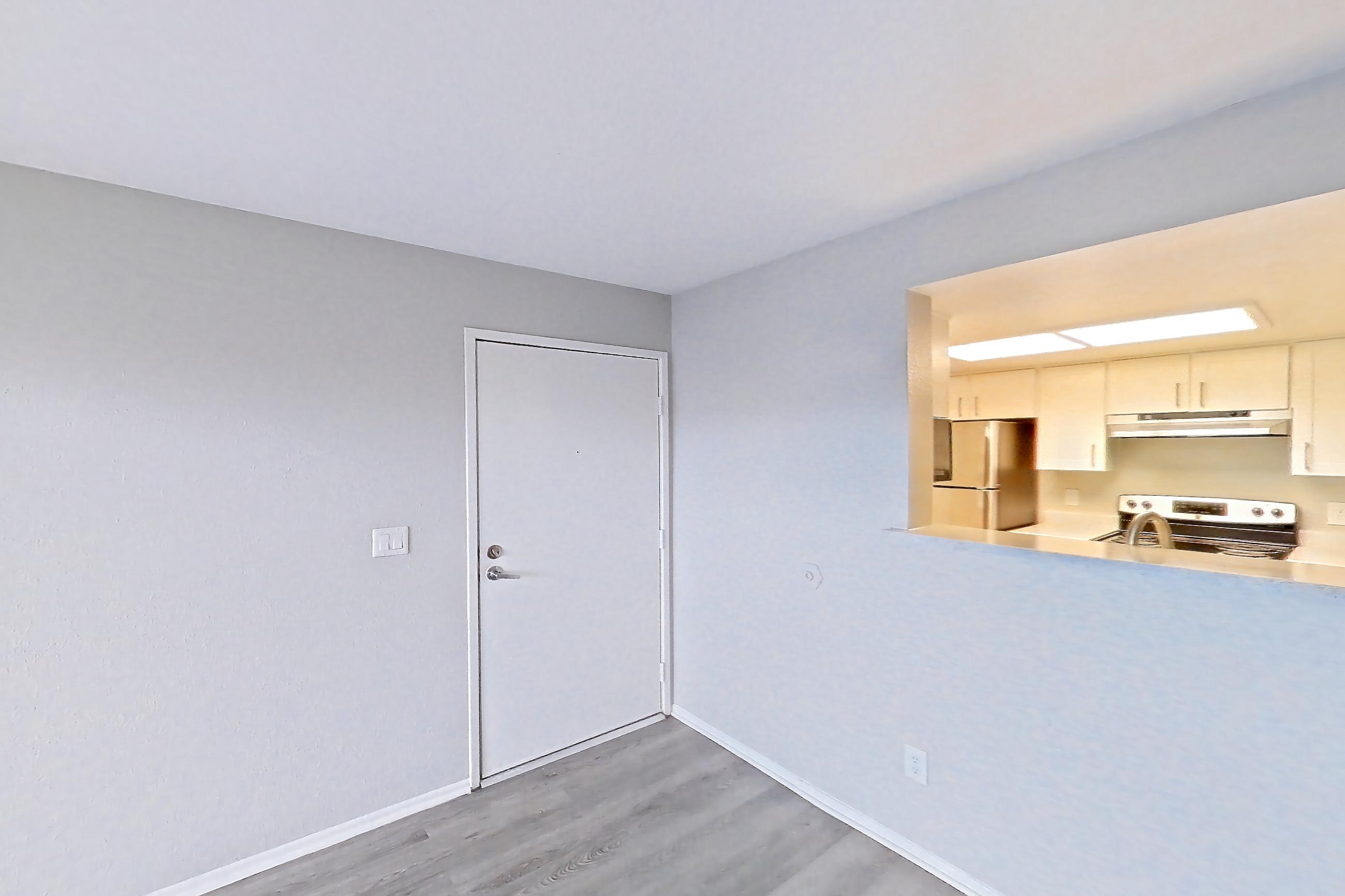 Living room with oven/range, refrigerator, stainless steel appliances, and white appliances, Apartment 11 at Avana Rancho Cucamonga