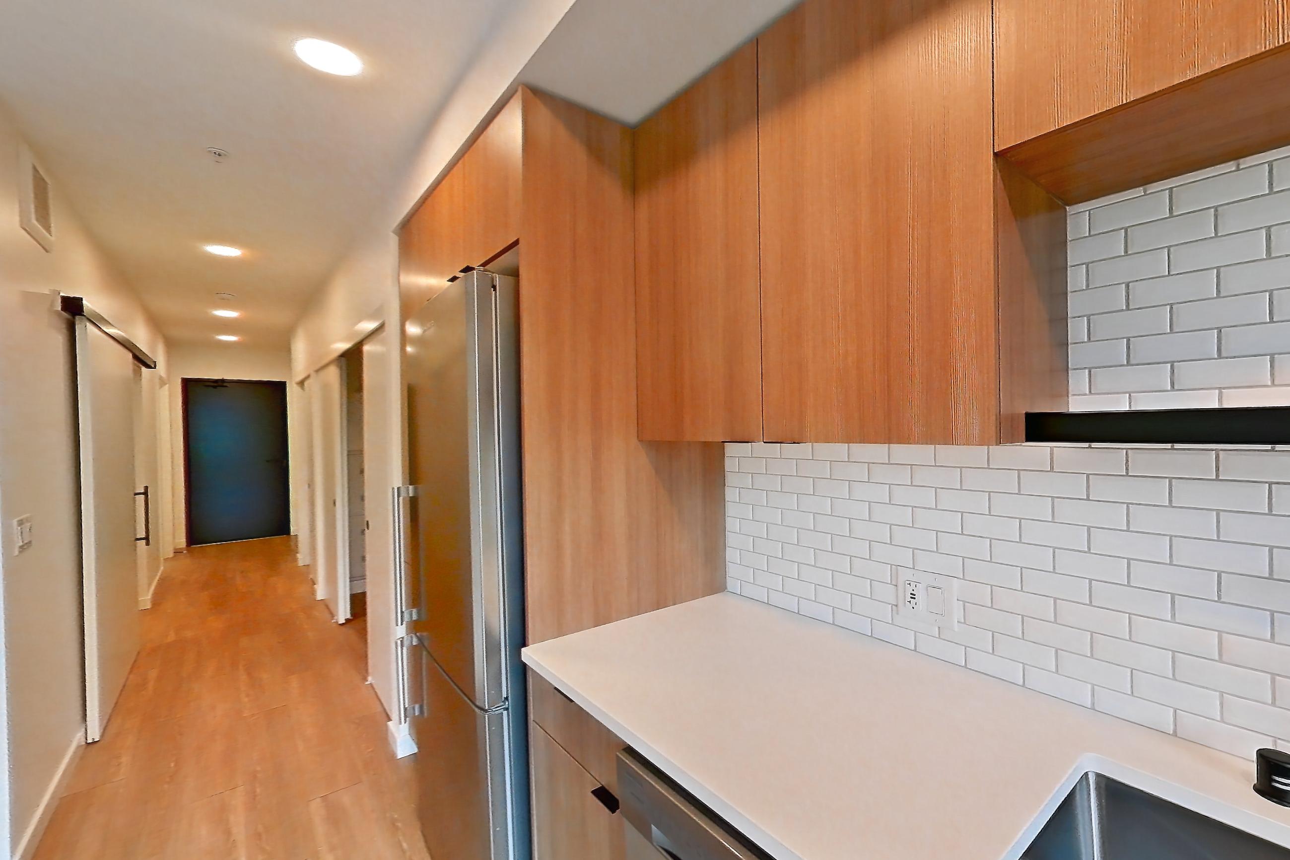 Kitchen in Apartment 525 at Ballard Yards, A5B floor plan