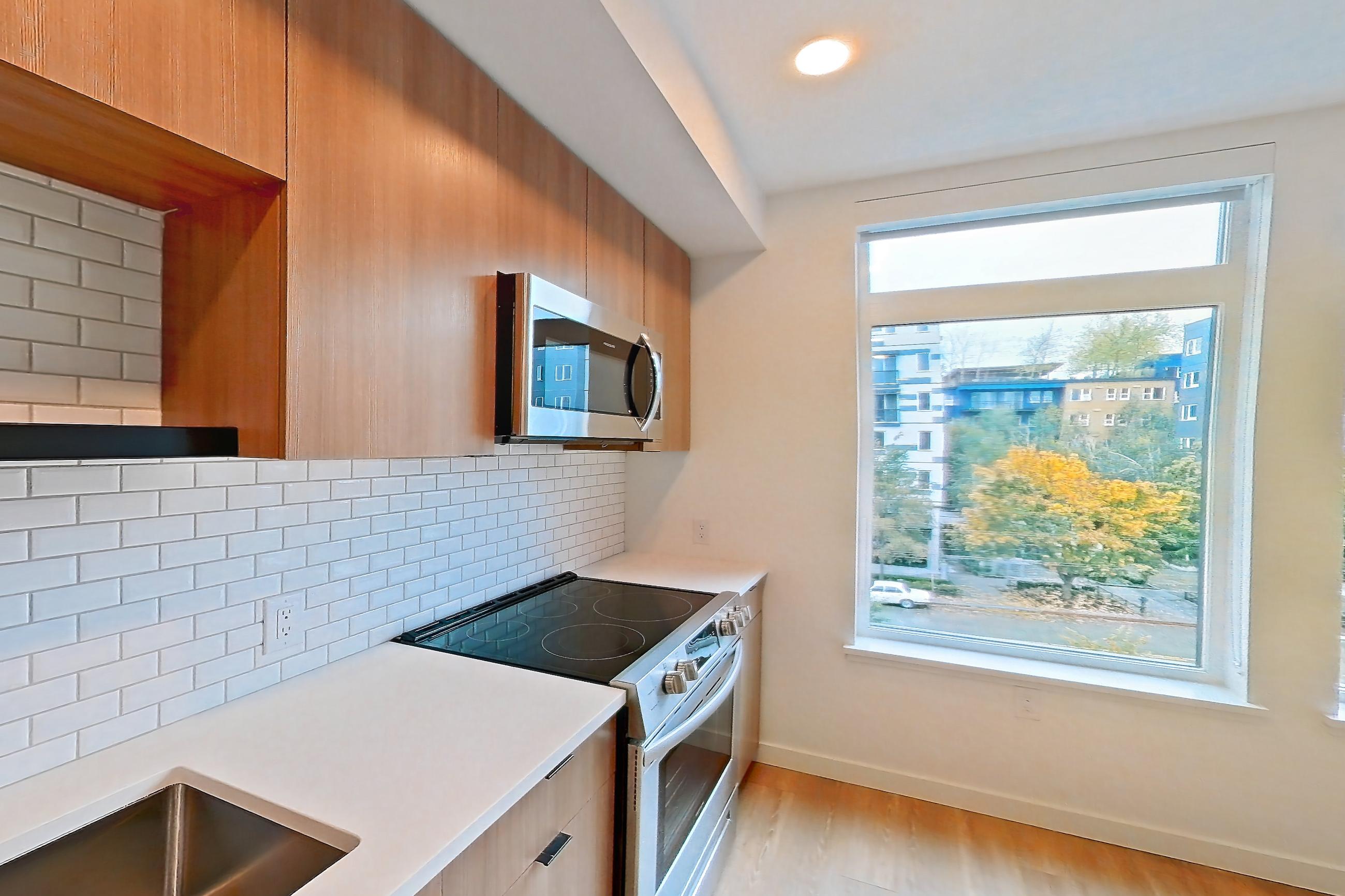 Kitchen in Apartment 525 at Ballard Yards, A5B floor plan