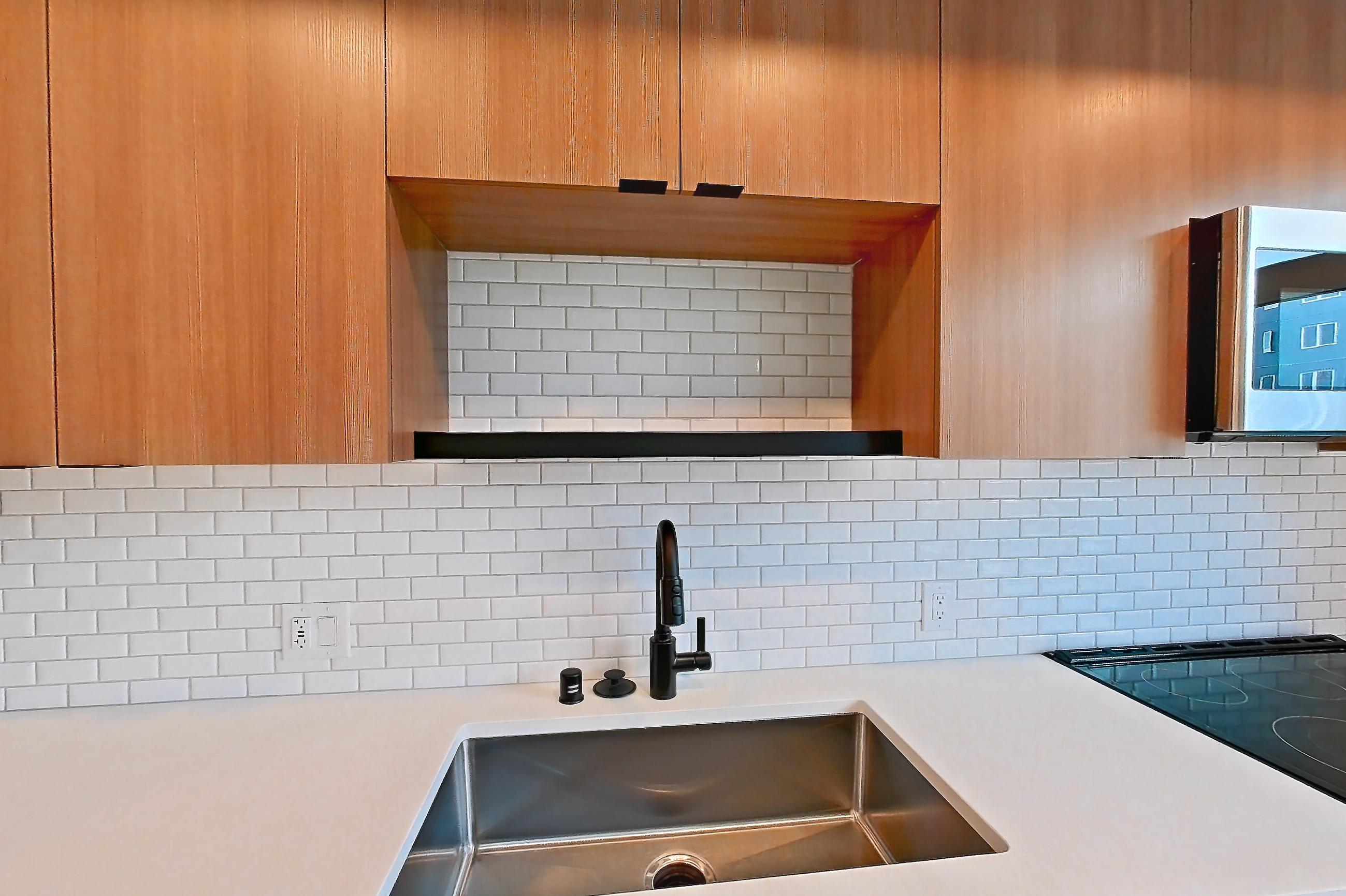 Kitchen in Apartment 525 at Ballard Yards, A5B floor plan