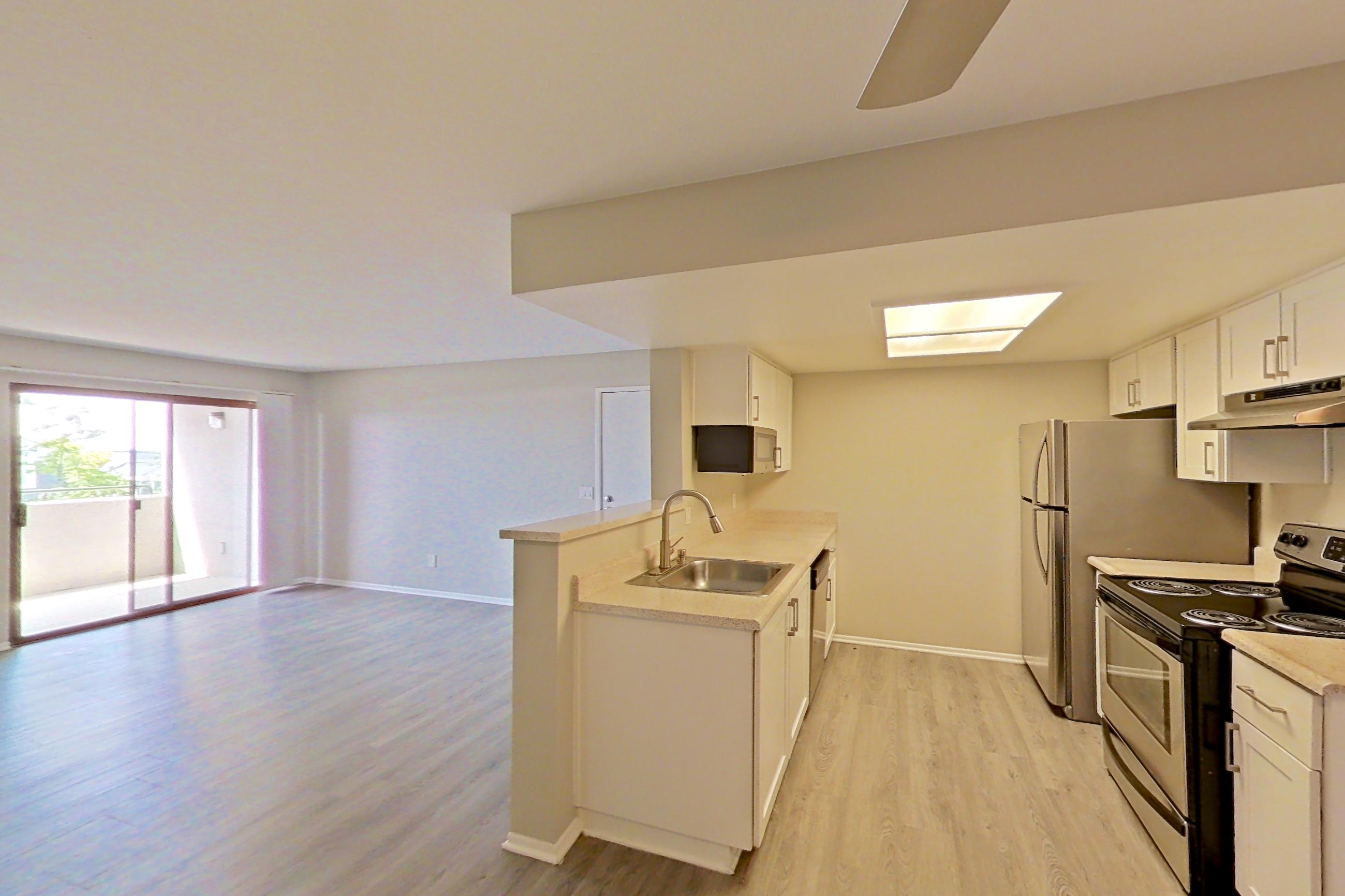 Dining area with light countertops and light wood-finish flooring, Apartment 10 at Avana Rancho Cucamonga