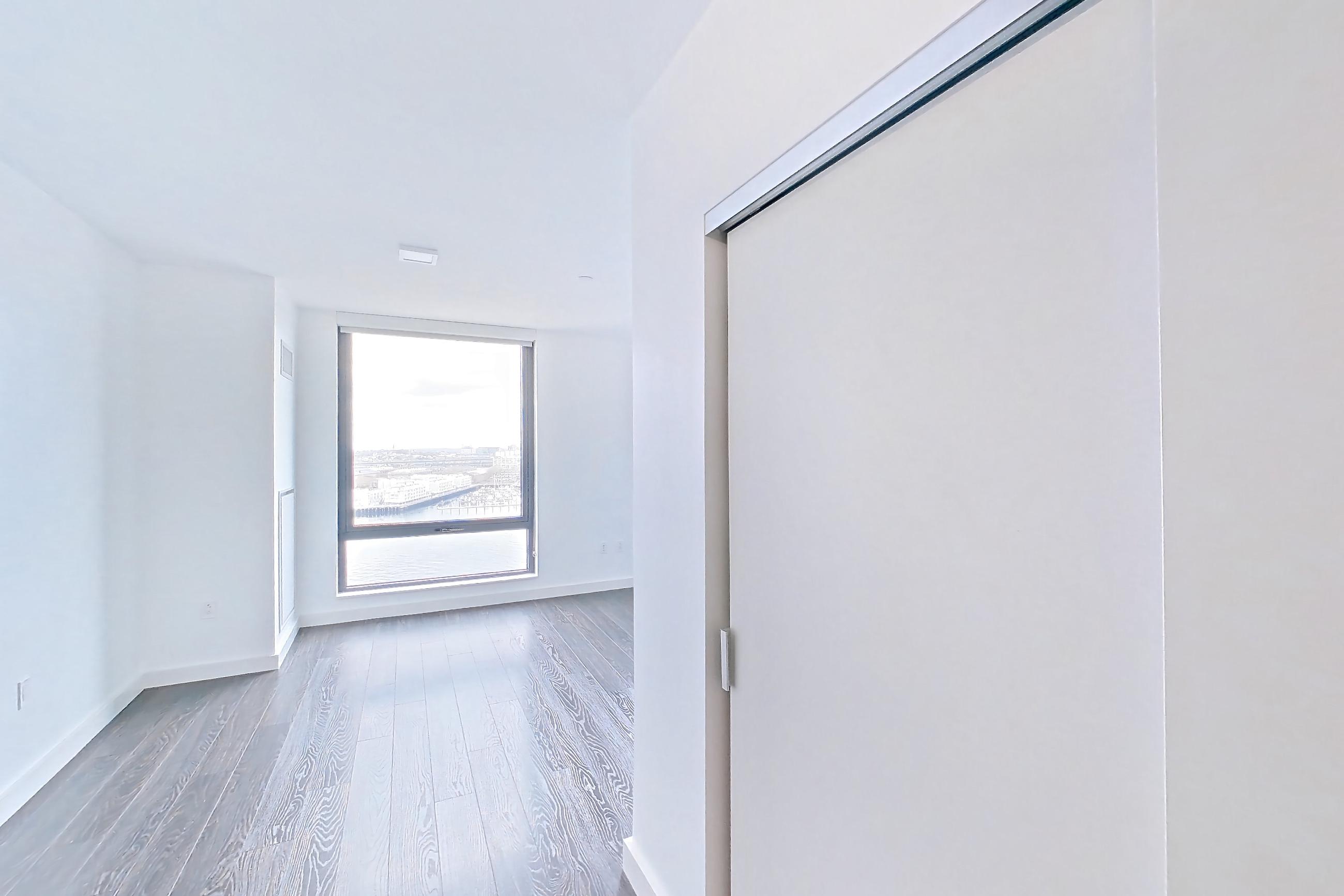 Kitchen with dark wood-finish flooring, Apartment 1316 at The Eddy