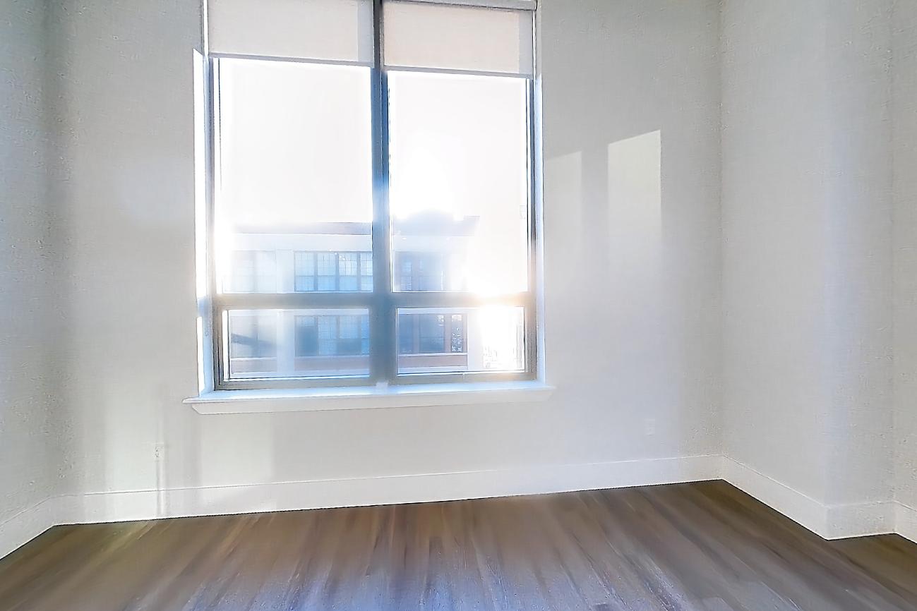 Living space with dark wood-finish flooring, Apartment SL-0527 at Soho Lofts