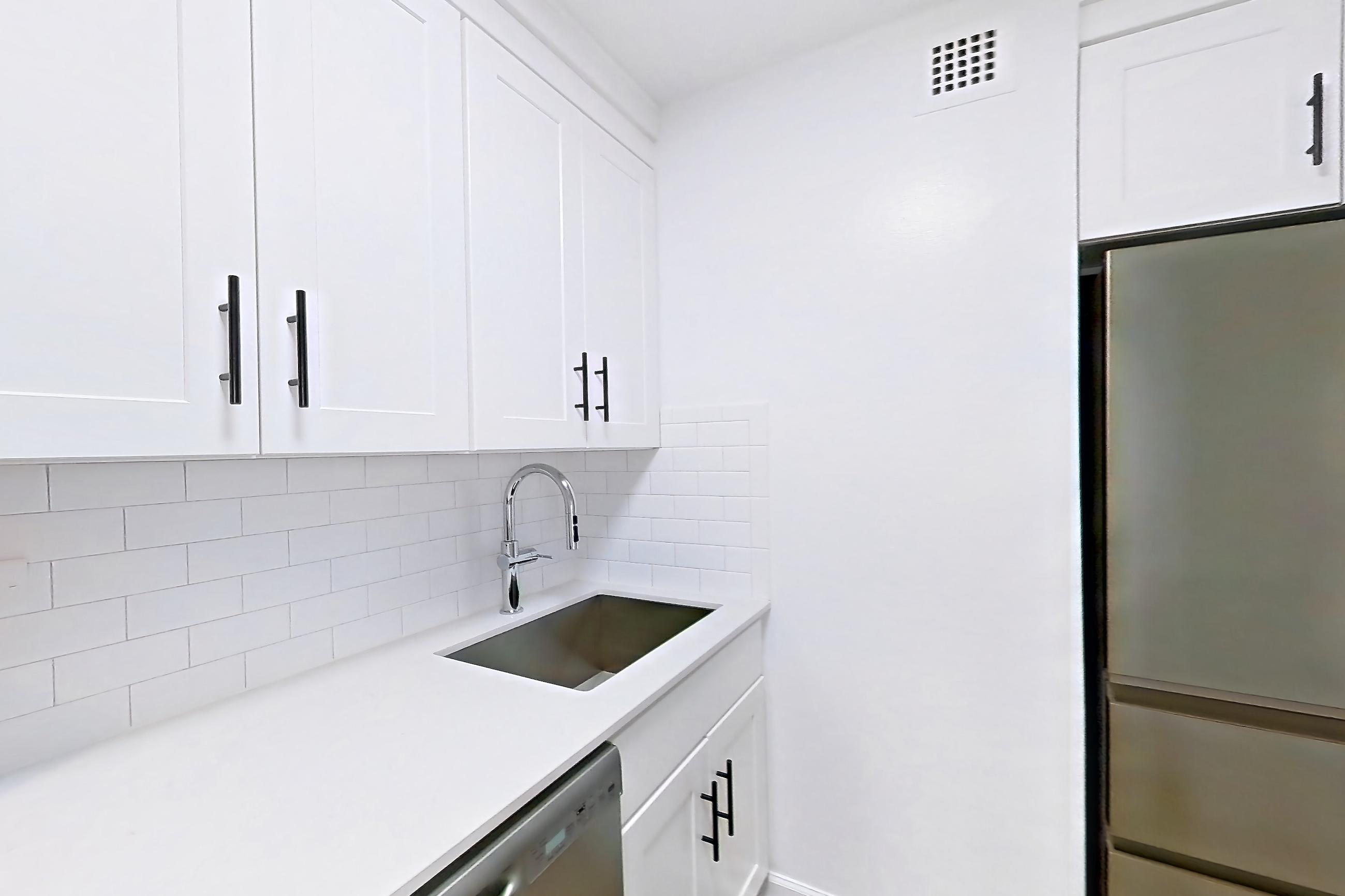 Kitchen in Apartment 30-30c at Waterside Plaza, 0B floor plan