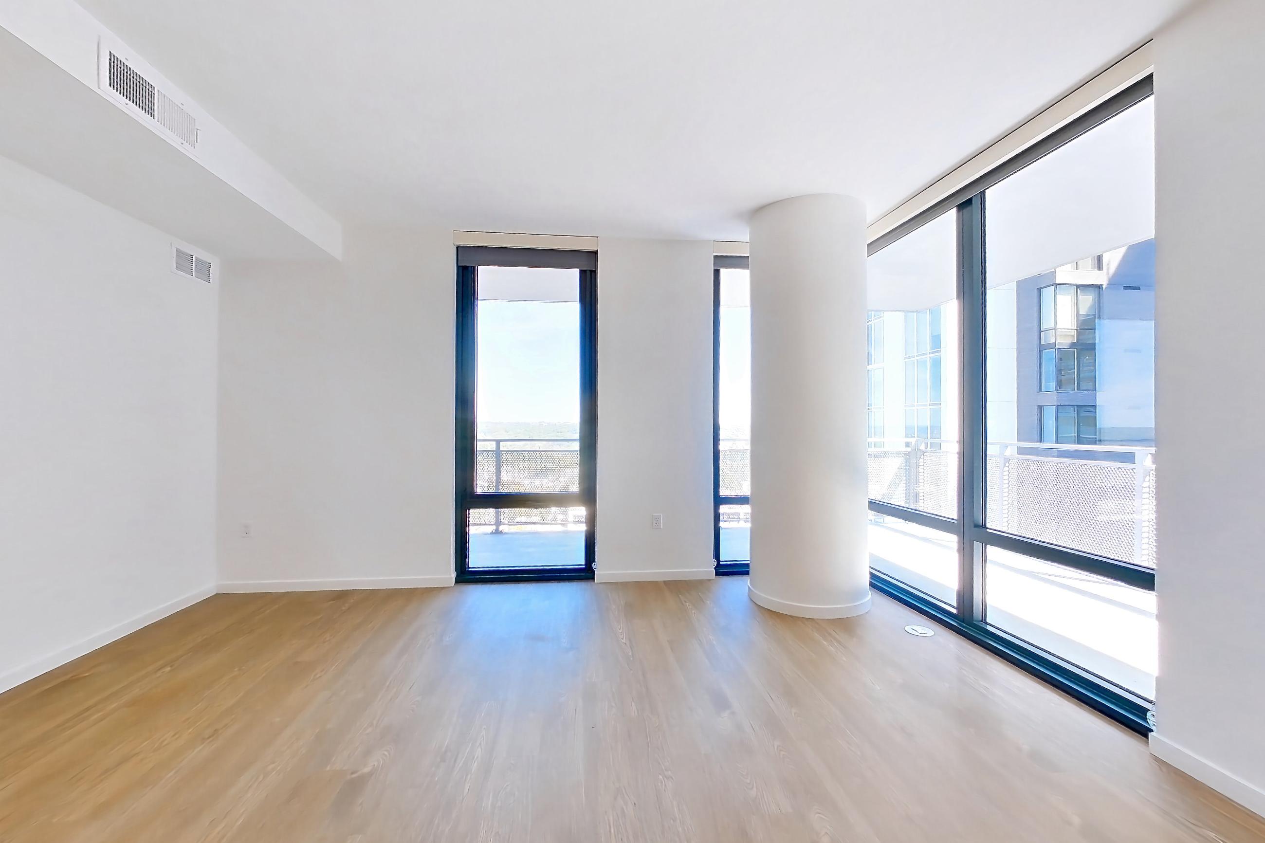 Living space with light wood-finish flooring, Apartment 1805 at Cortland Rosslyn