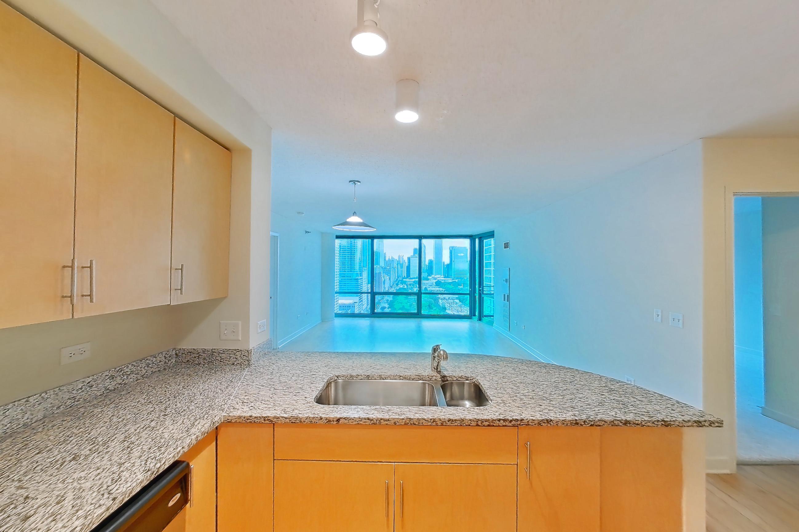 Kitchen in a 2D floor plan apartment, representative of Apartment 00-3207 at Sky55