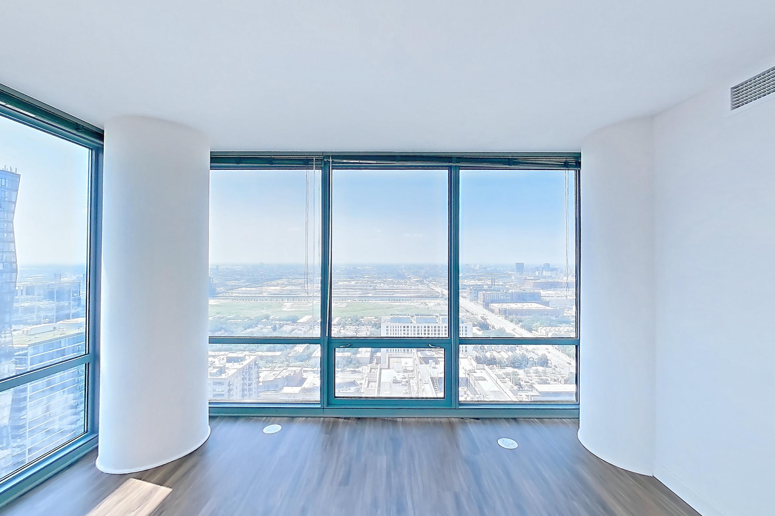 Living room with city view, Apartment 00-PH08 at Sky55