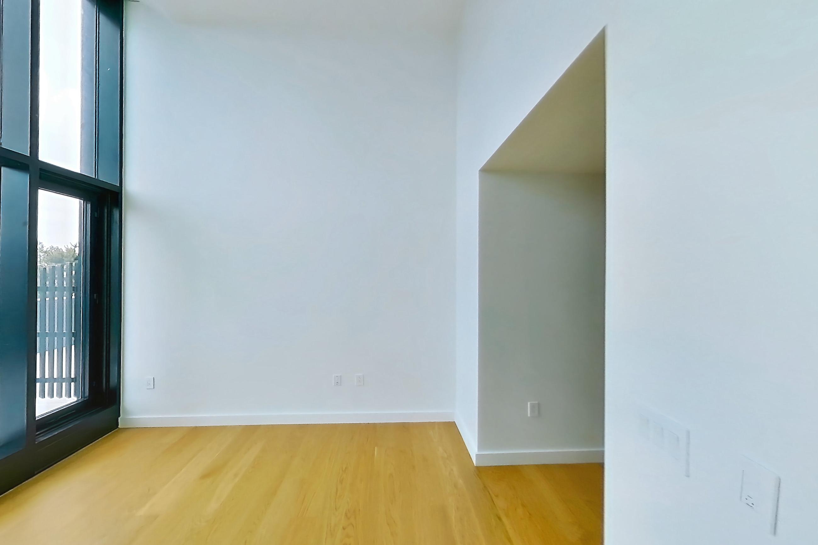 Living space with light wood-finish flooring, Apartment 1-0101 at Eagle + West