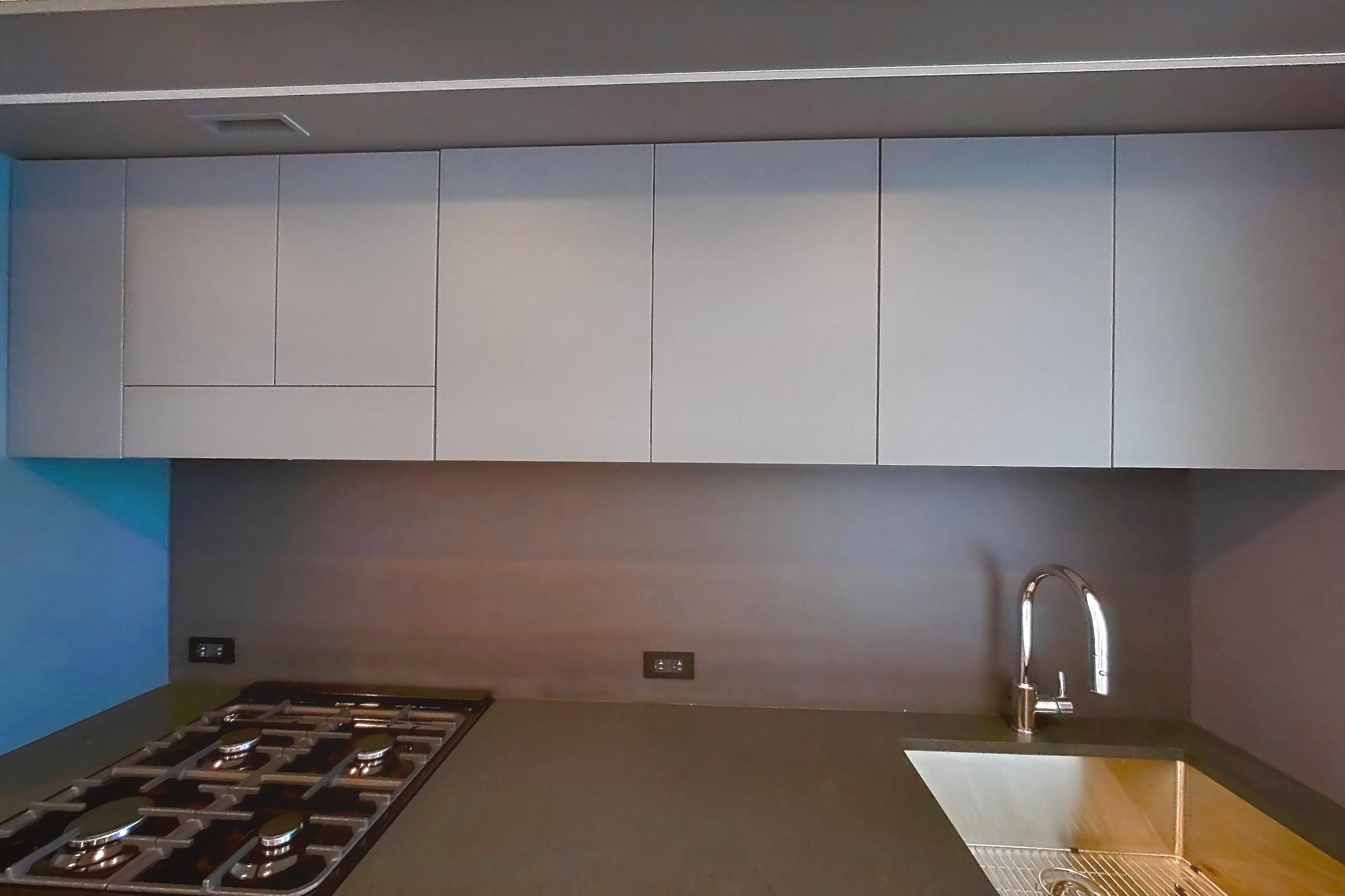 Kitchen with gas range, light wood-finish flooring, oven/range, and stainless steel appliances, Apartment 1-3111 at Eagle + West