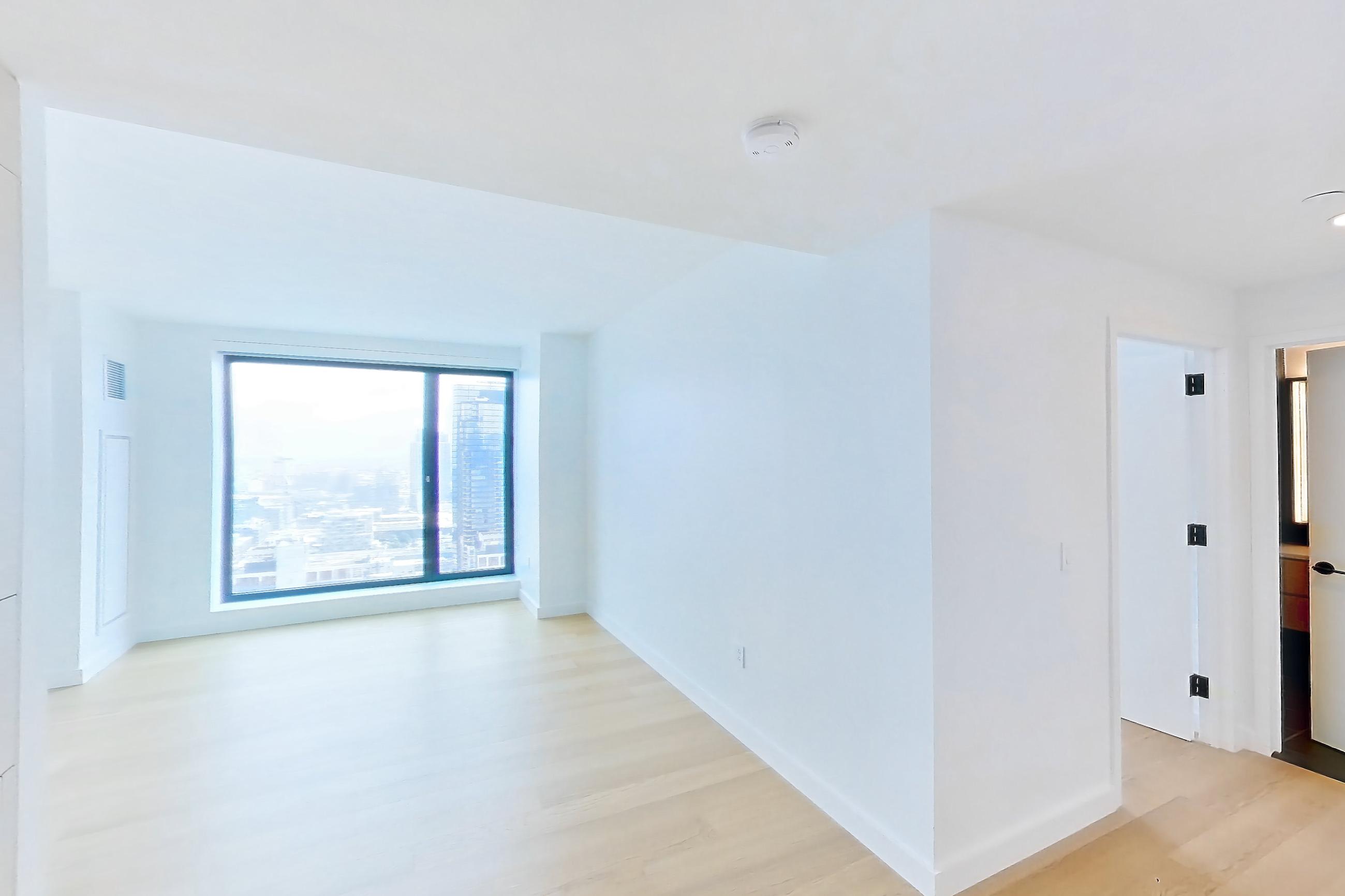 Kitchen with gas range, light wood-finish flooring, oven/range, and stainless steel appliances, Apartment 1-3111 at Eagle + West