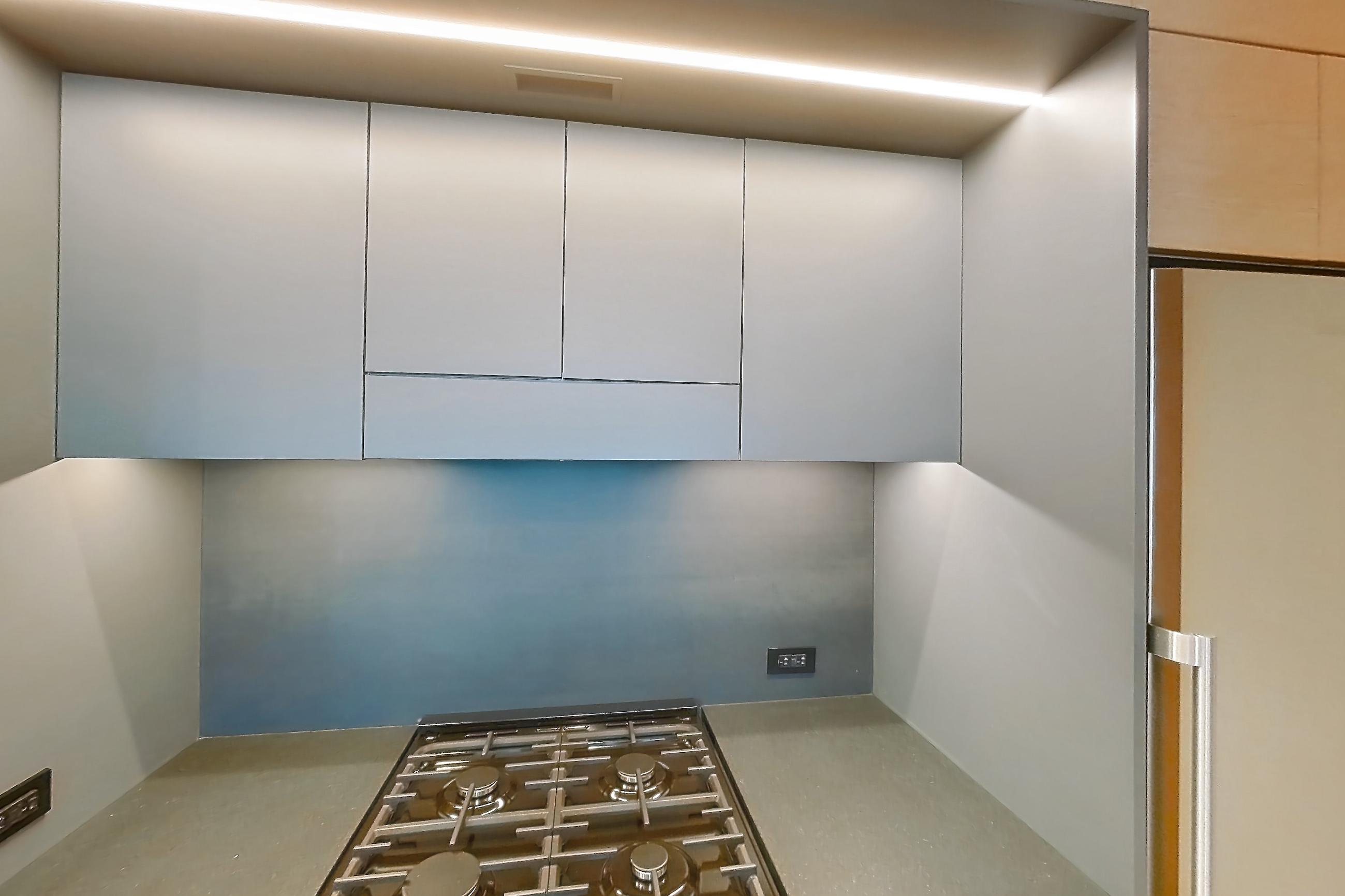 Kitchen with gas range, light wood-finish flooring, oven/range, and stainless steel appliances, Apartment 1-2505 at Eagle + West