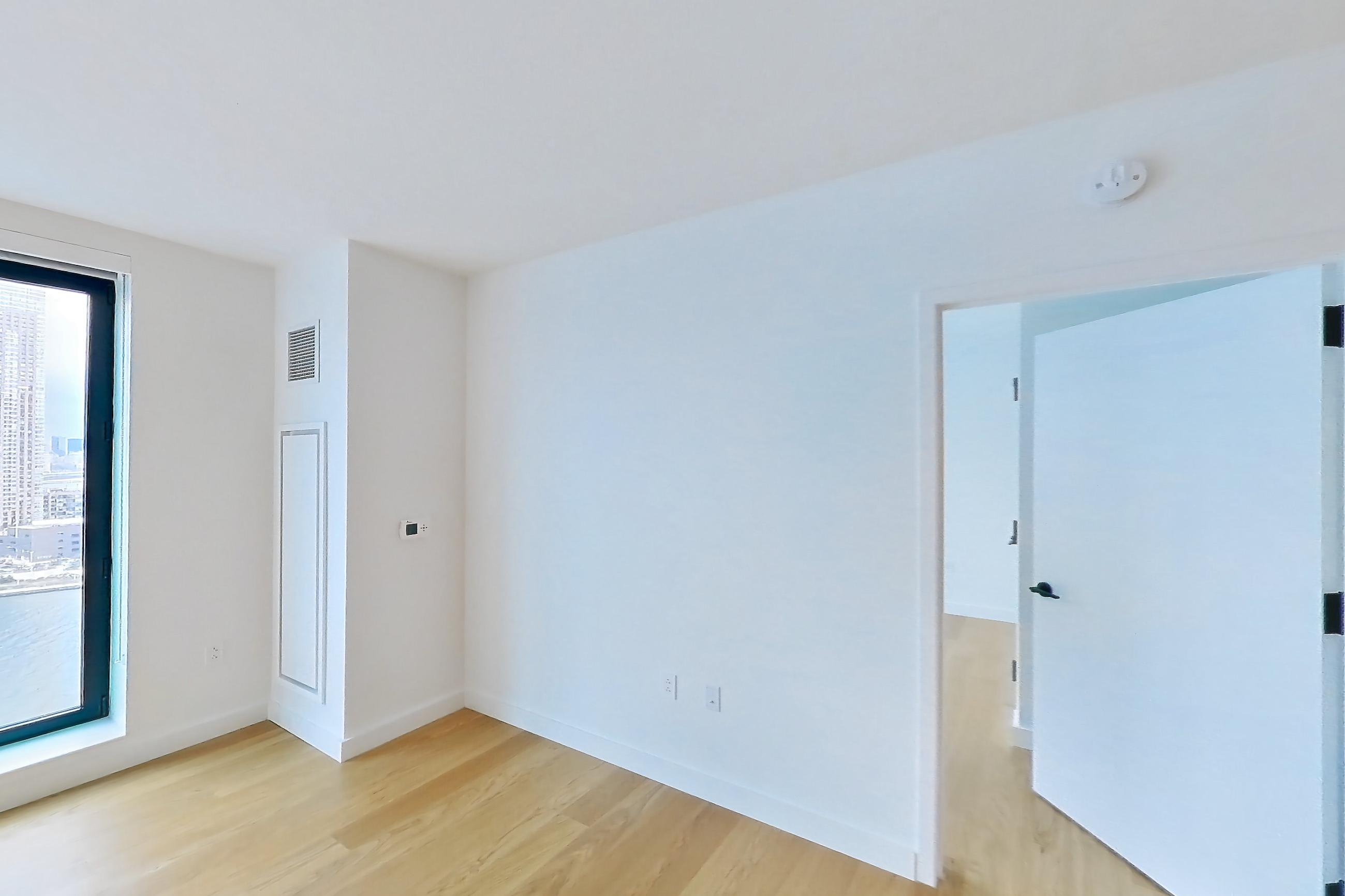 Living room in Apartment 1-2205 at Eagle + West, 1U floor plan