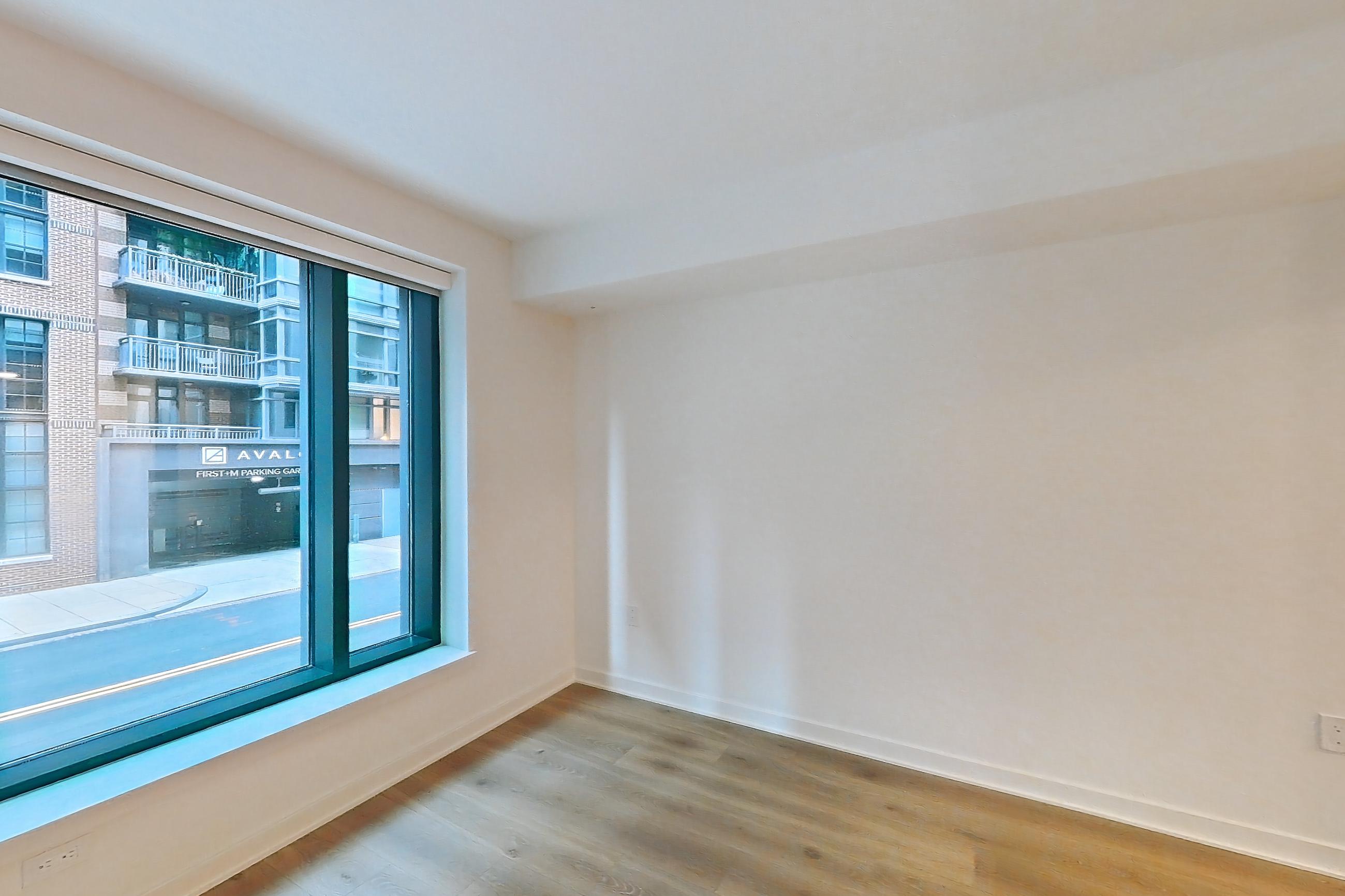 Living room with light wood-finish flooring, Apartment 0209 at The Hale