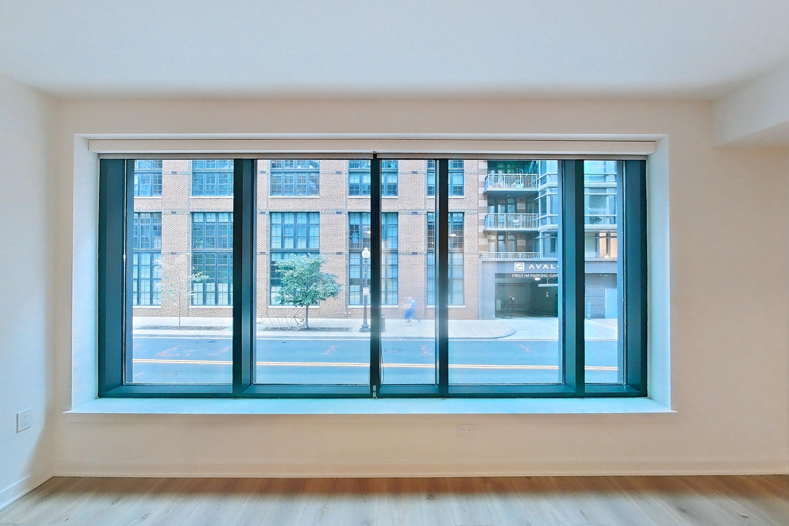 Living room with light wood-finish flooring, Apartment 0209 at The Hale