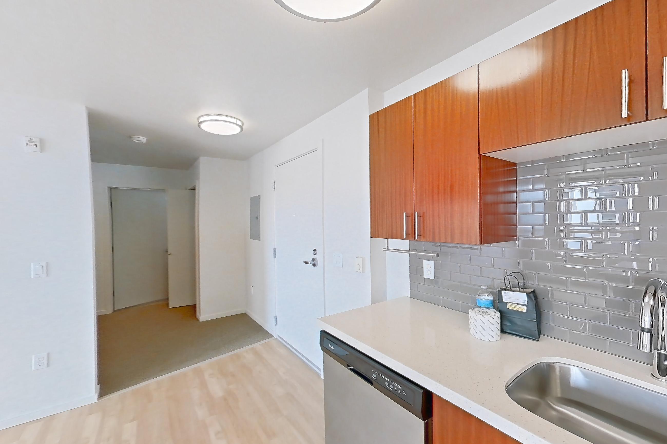 Kitchen in a Brewster floor plan unit, representative of Unit L535 at Union SLU