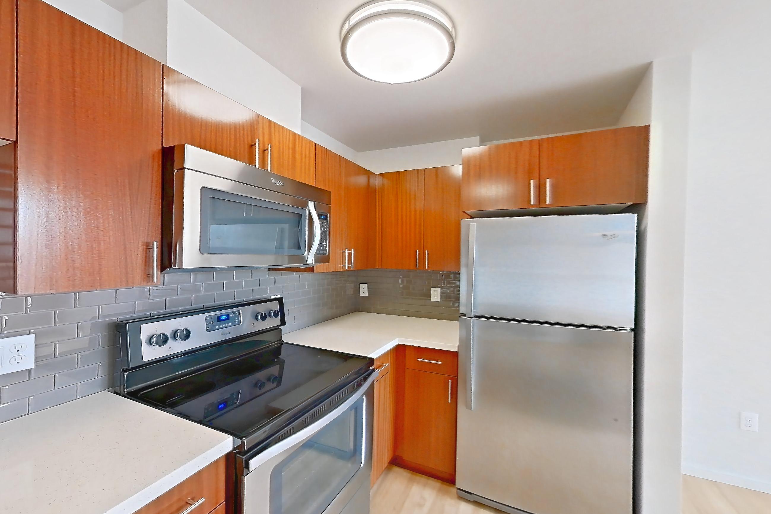 Kitchen in a Brewster floor plan unit, representative of Unit L535 at Union SLU