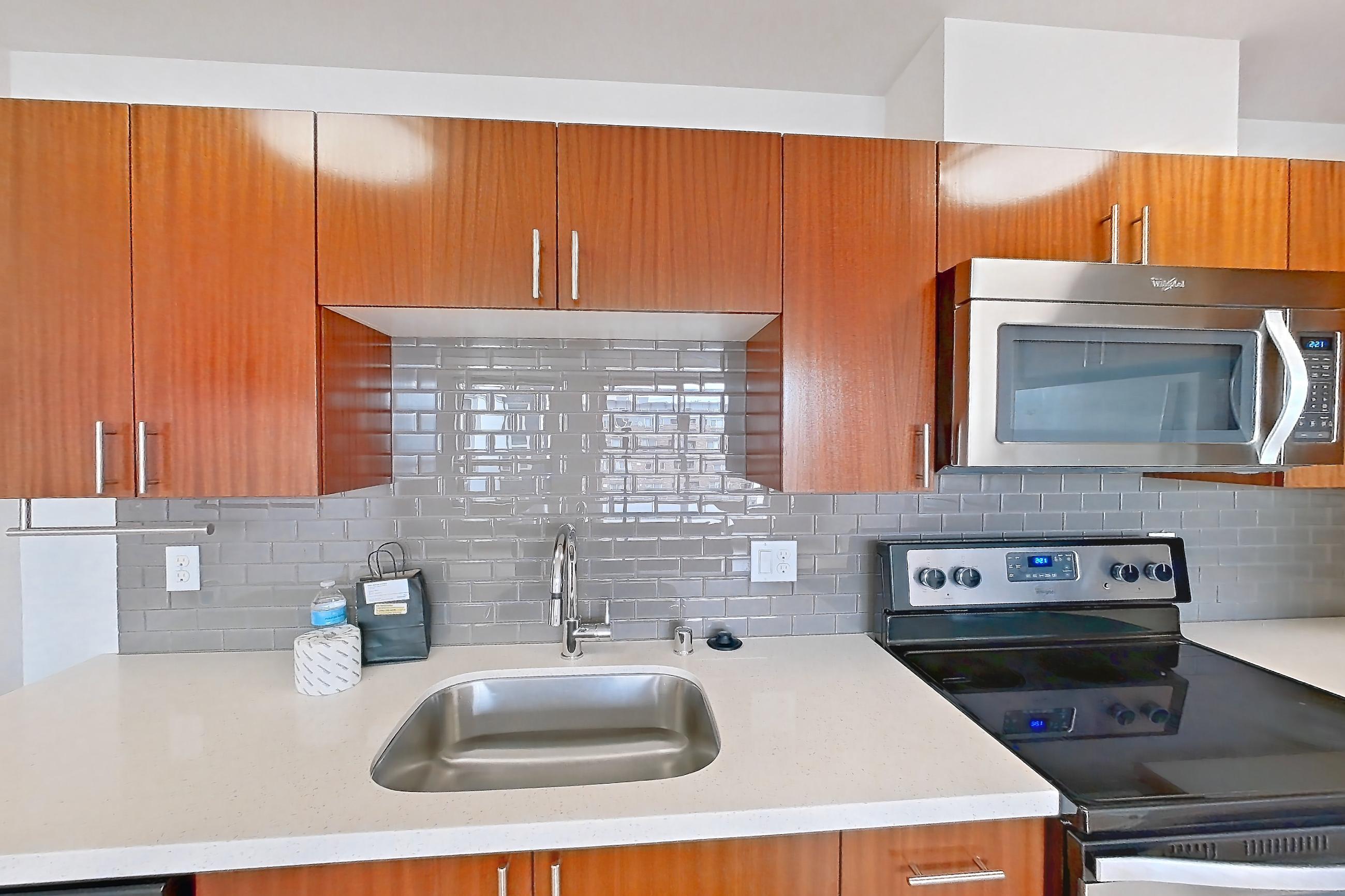 Kitchen in a Brewster floor plan unit, representative of Unit L535 at Union SLU