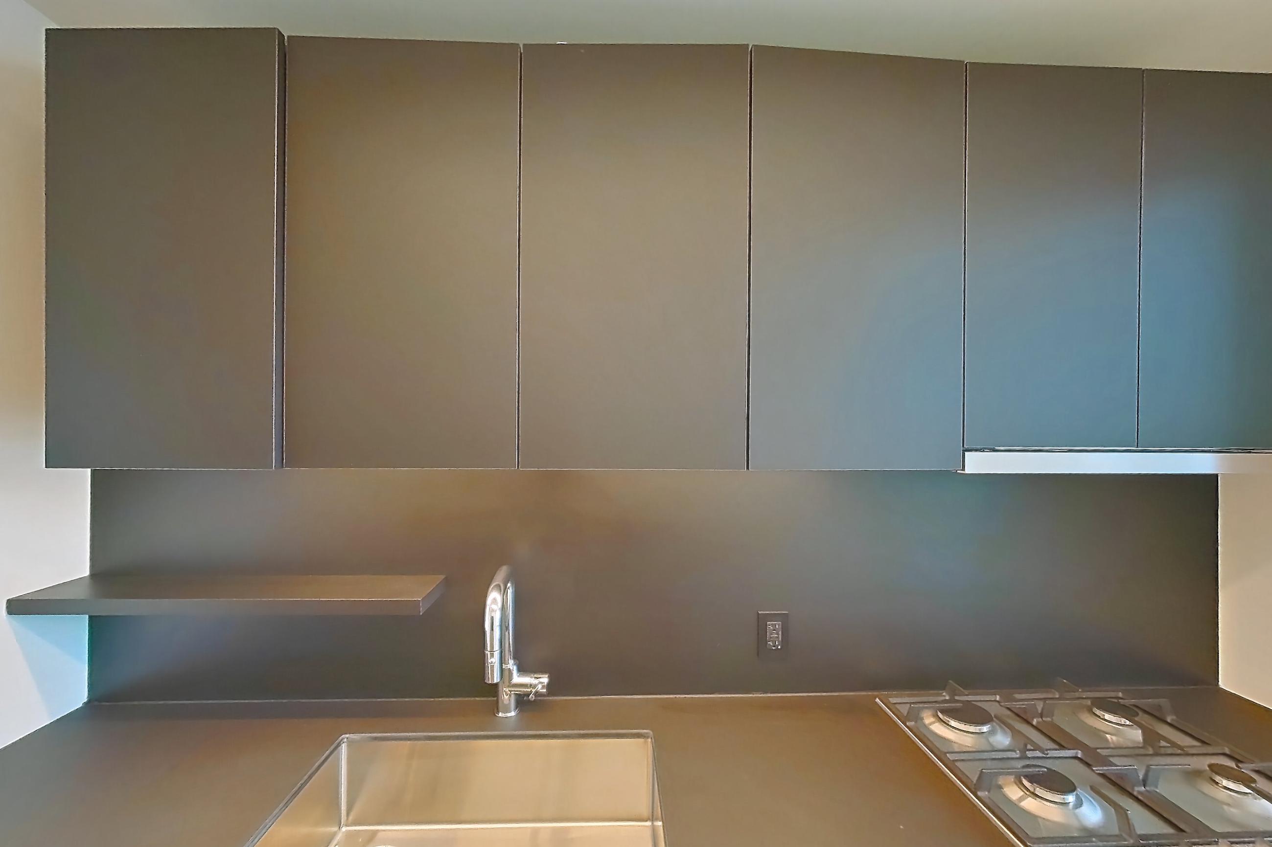 Kitchen with cooktop, gas cooktop, and stainless steel appliances, Apartment E-0654 at Lincoln at Bankside