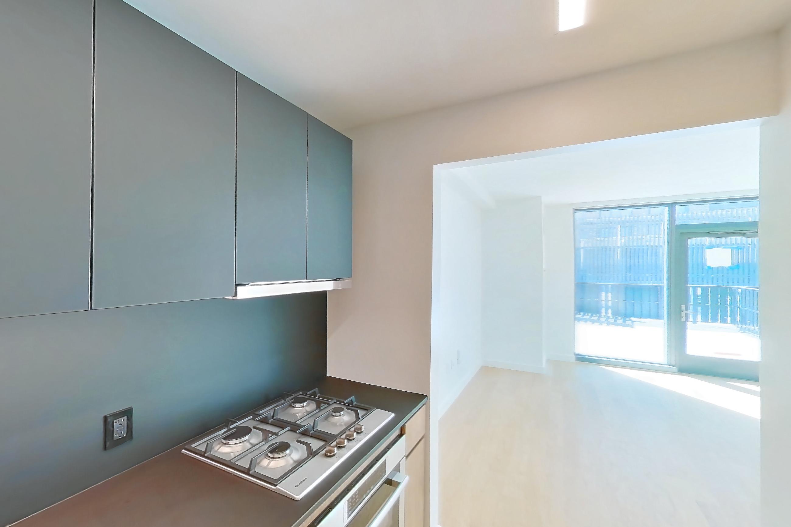 Kitchen with cooktop, gas cooktop, and stainless steel appliances, Apartment S-0818 at Lincoln at Bankside