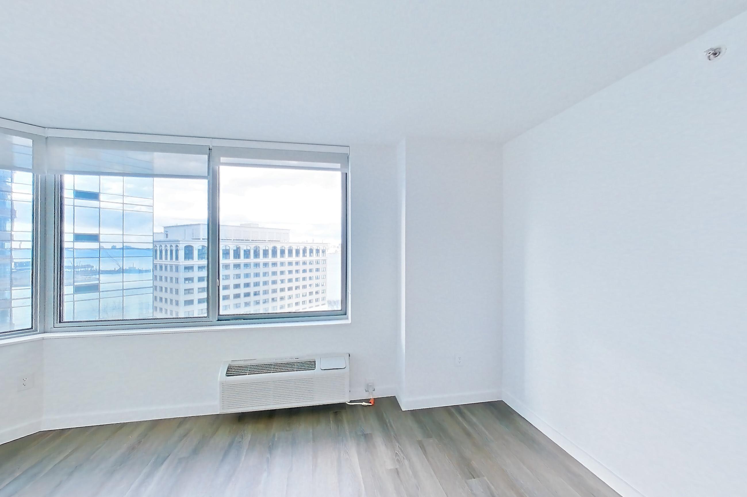 Living room with air conditioning, Apartment LT-E1605 at Liberty Towers