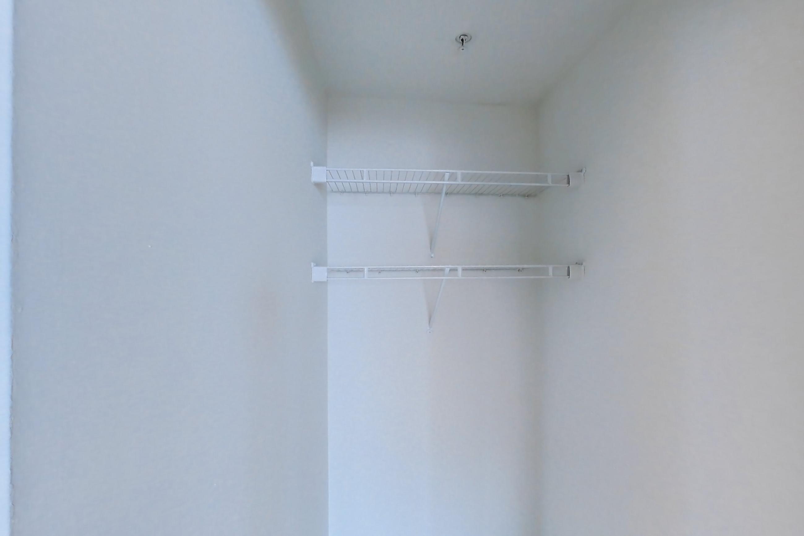 Living room cloest with air conditioning and dark wood-finish flooring, Apartment LT-E2905 at Liberty Towers
