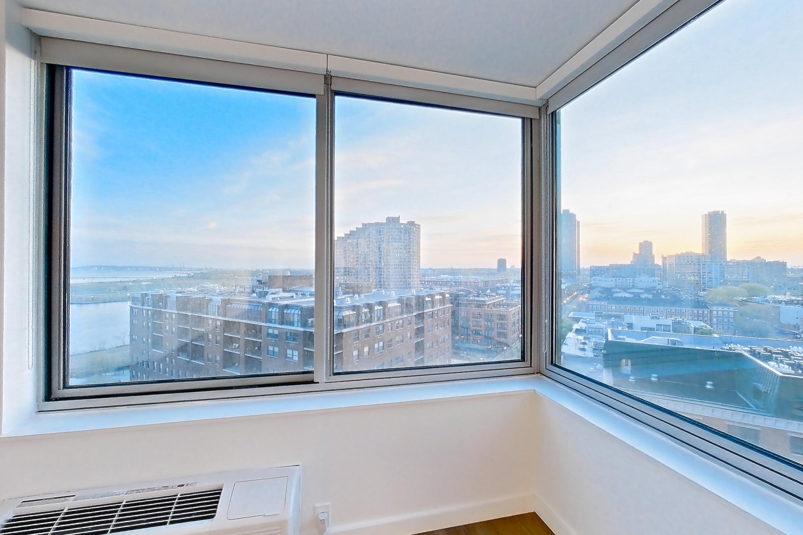 Living room with city view and skyline view, Apartment LT-W1201 at Liberty Towers