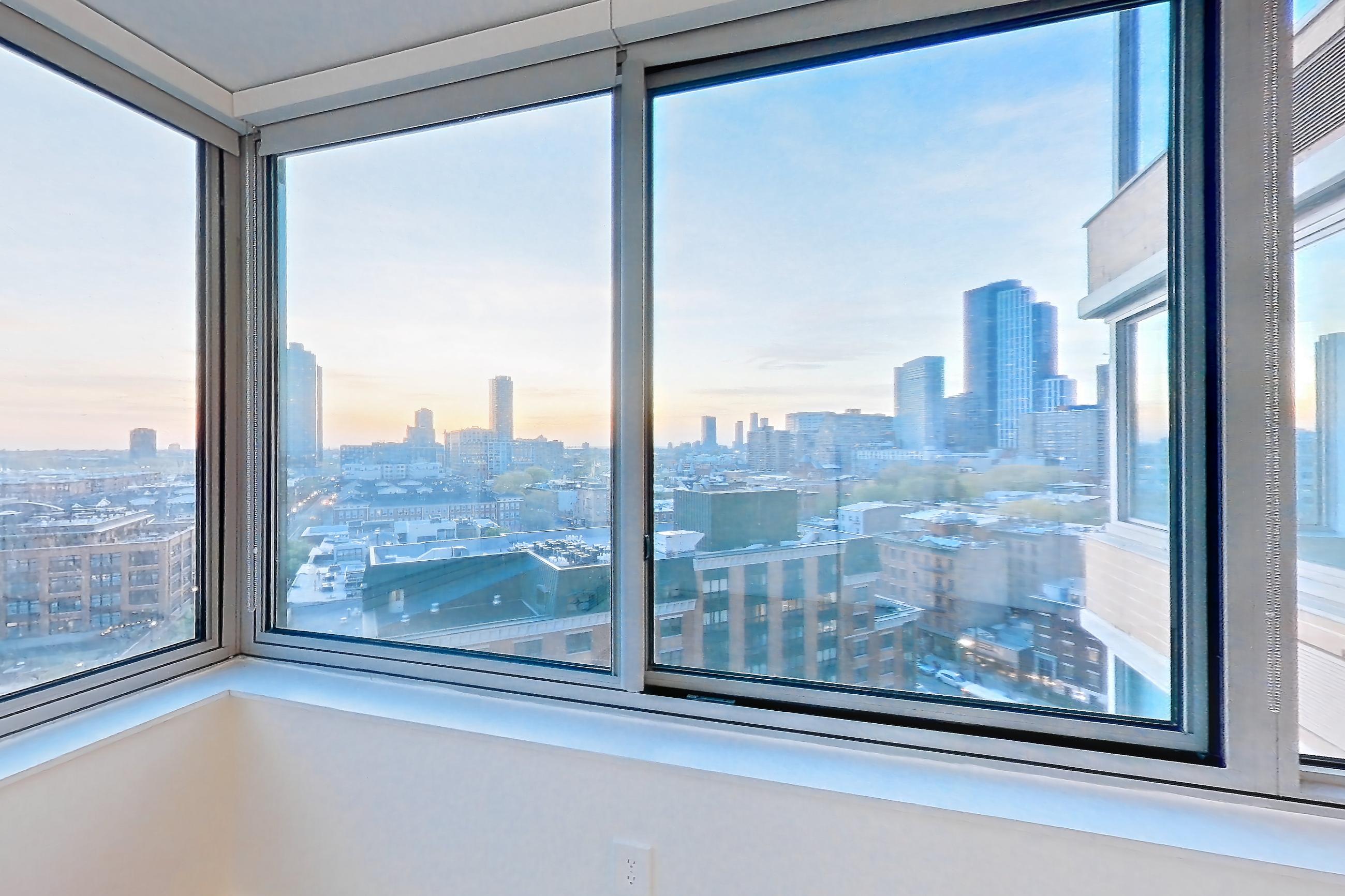Living room with city view and skyline view, Apartment LT-W1201 at Liberty Towers