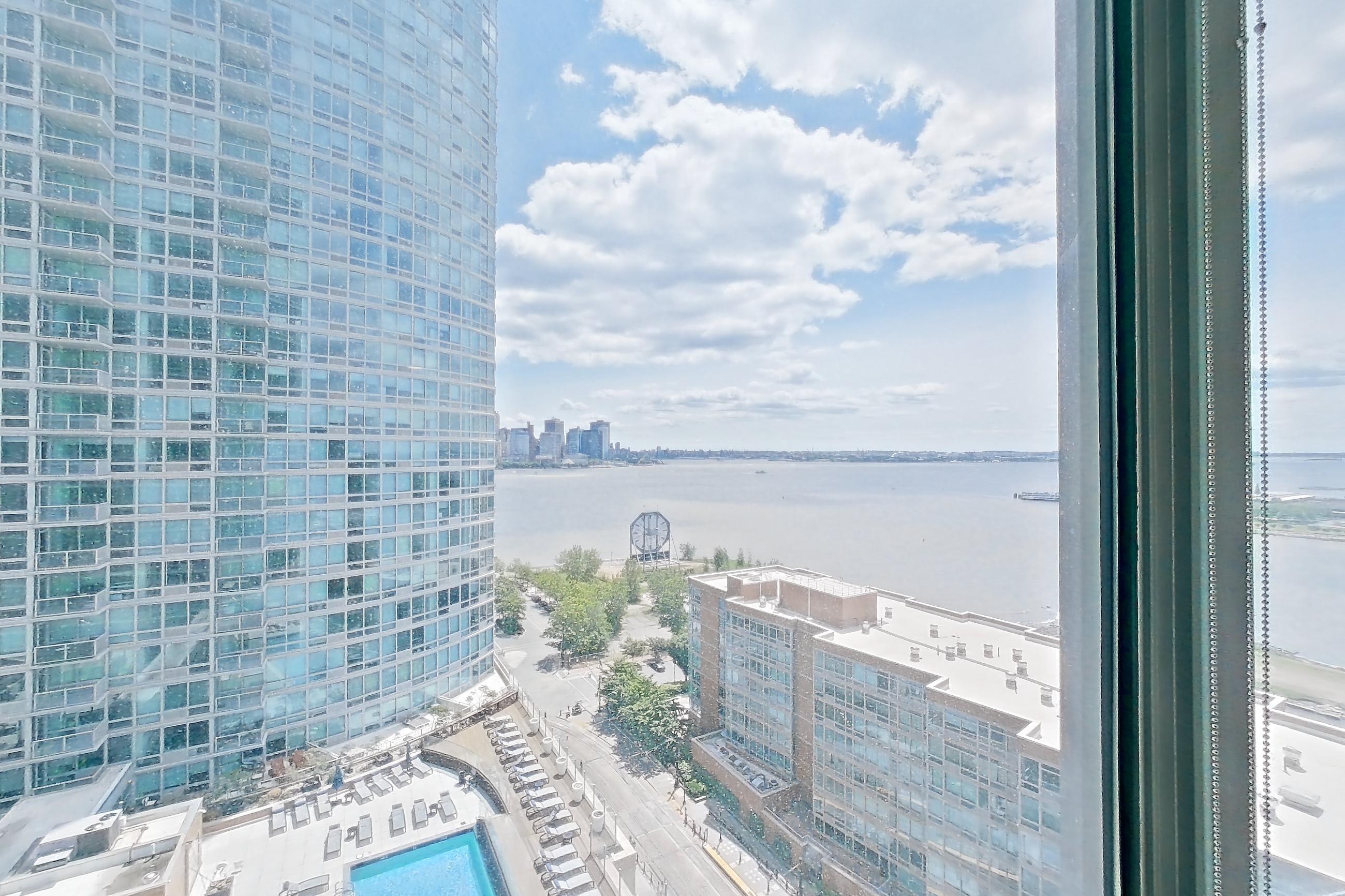 Living room view with city view, Apartment LT-W1811 at Liberty Towers