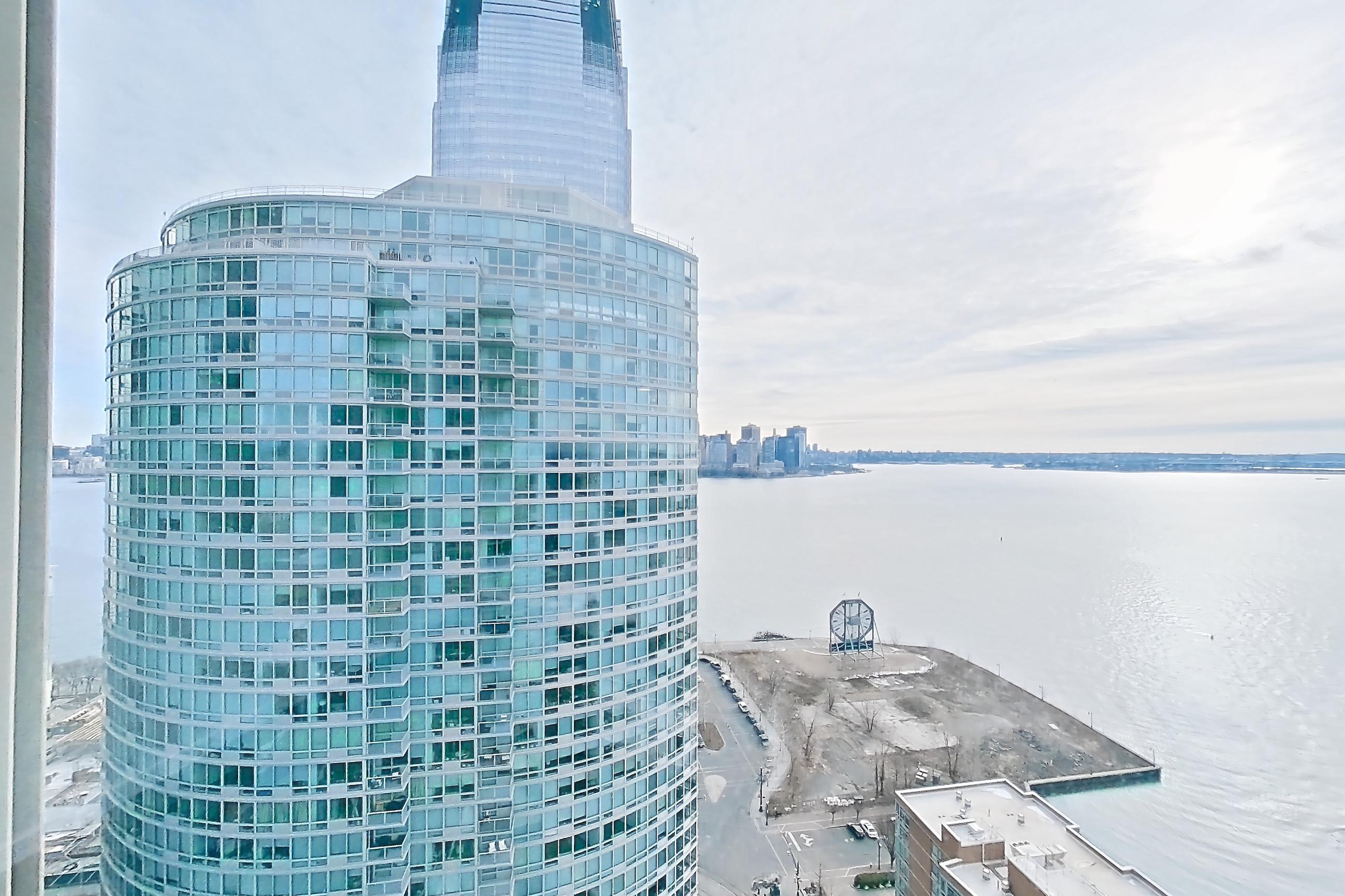 Living room view with city view, Apartment LT-W3011 at Liberty Towers