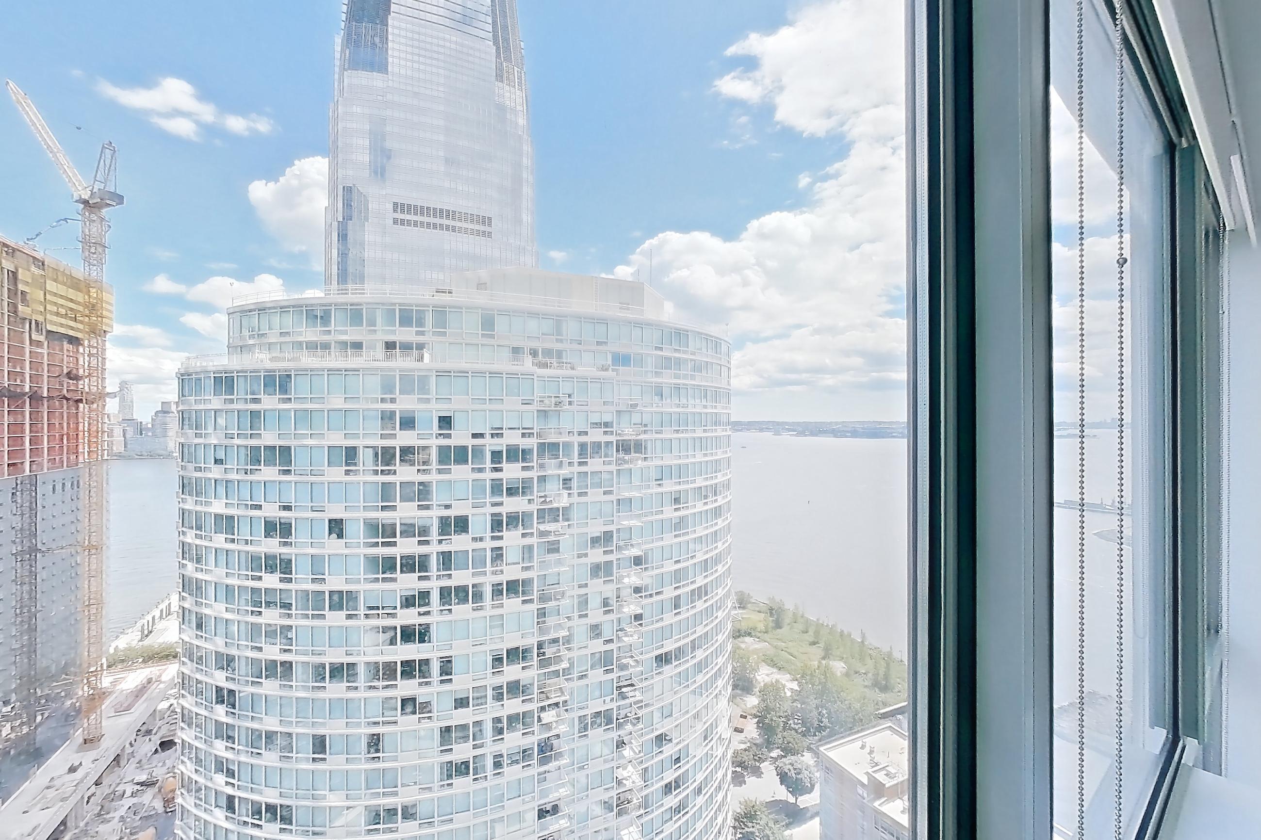 Living room view with water view, Apartment LT-W3408 at Liberty Towers
