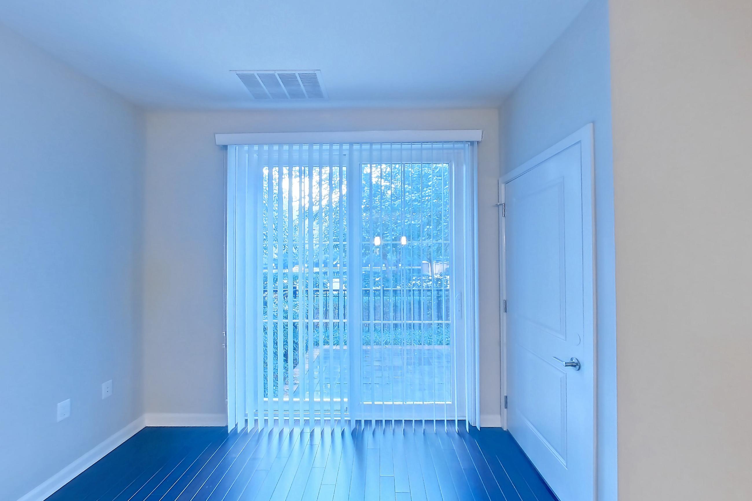 Living room with dark wood-finish flooring, Apartment 2120 at Quarry Place Tuckahoe