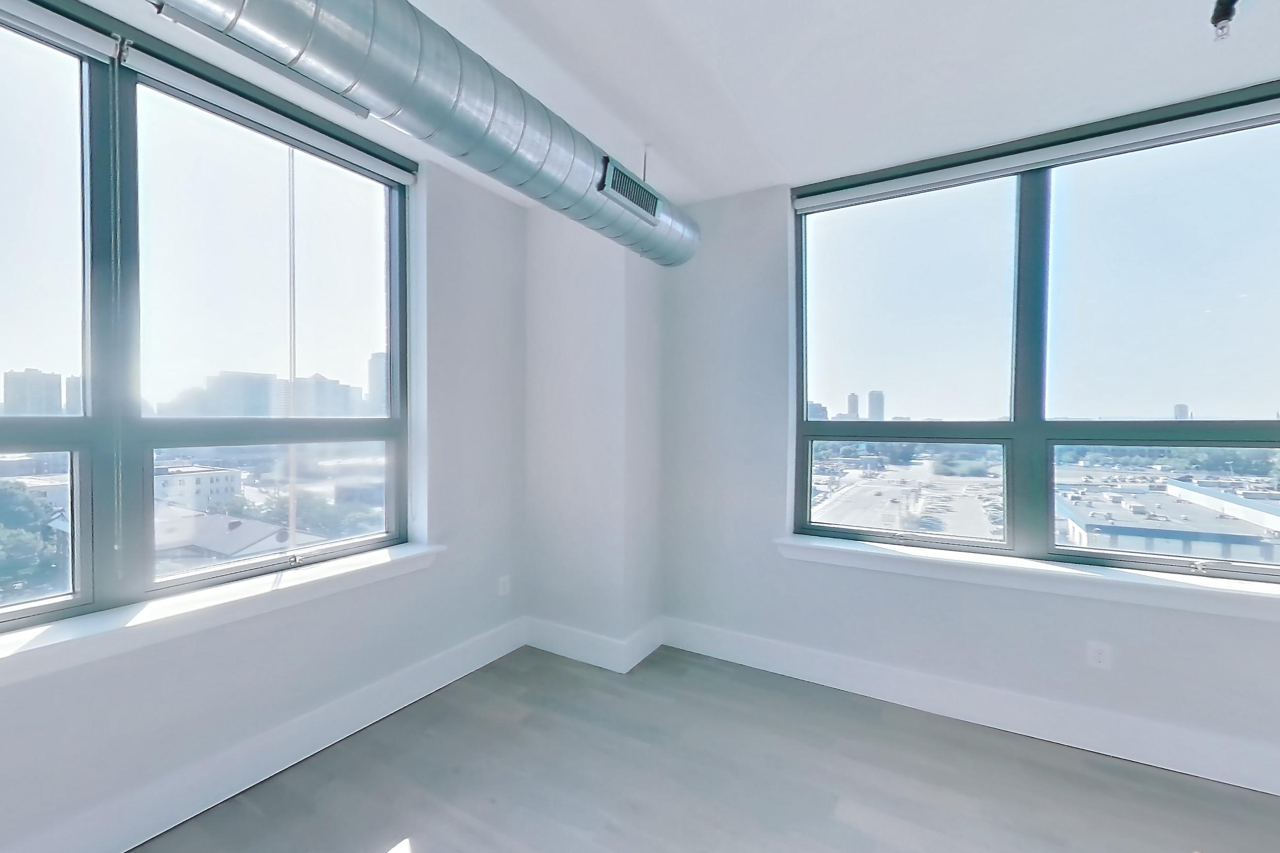Living room with light wood-finish flooring, oven/range, and stainless steel appliances, Apartment SL-0807 at Soho Lofts