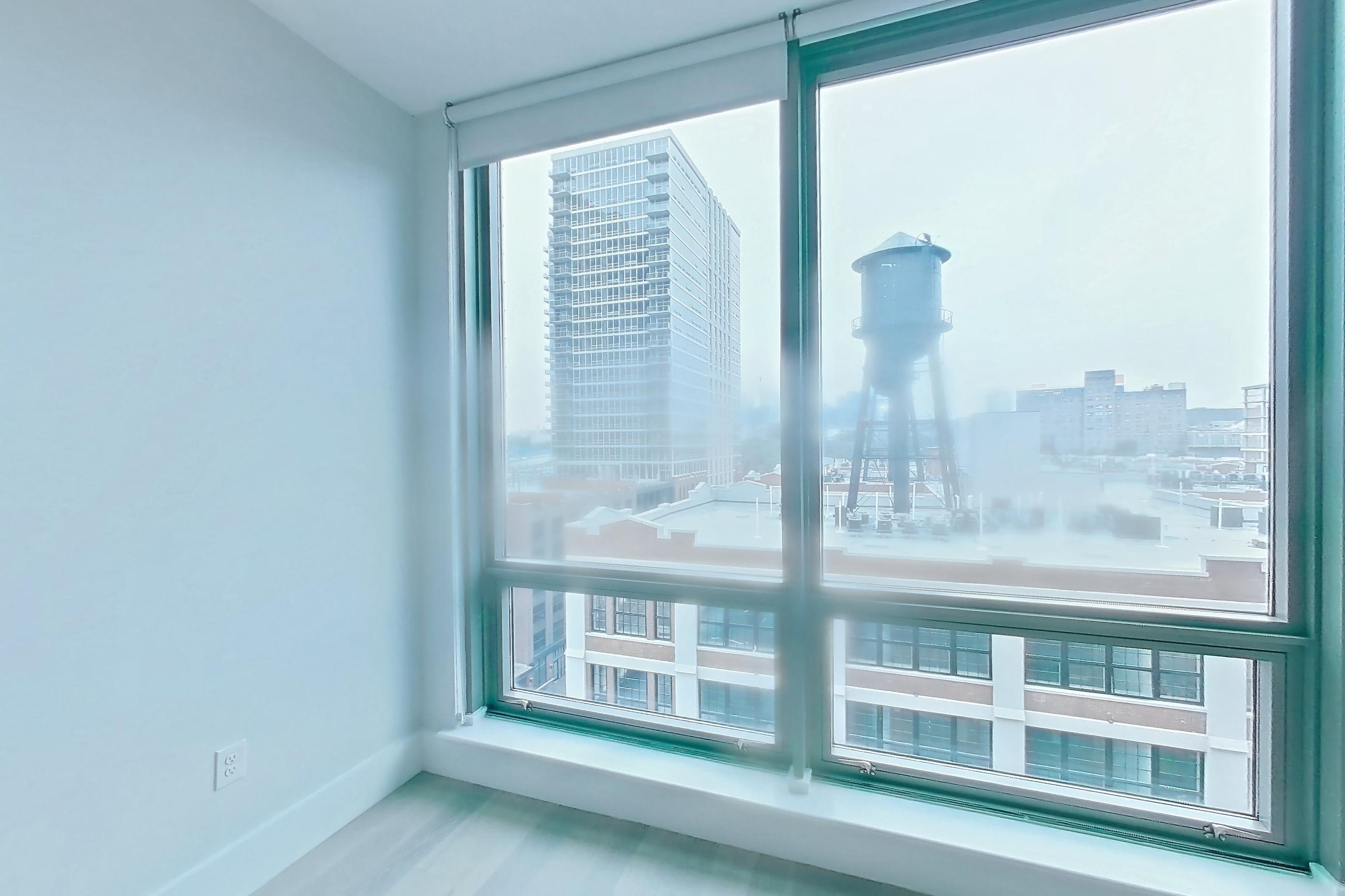 Living room with city view and skyline view, Apartment SL-0822 at Soho Lofts