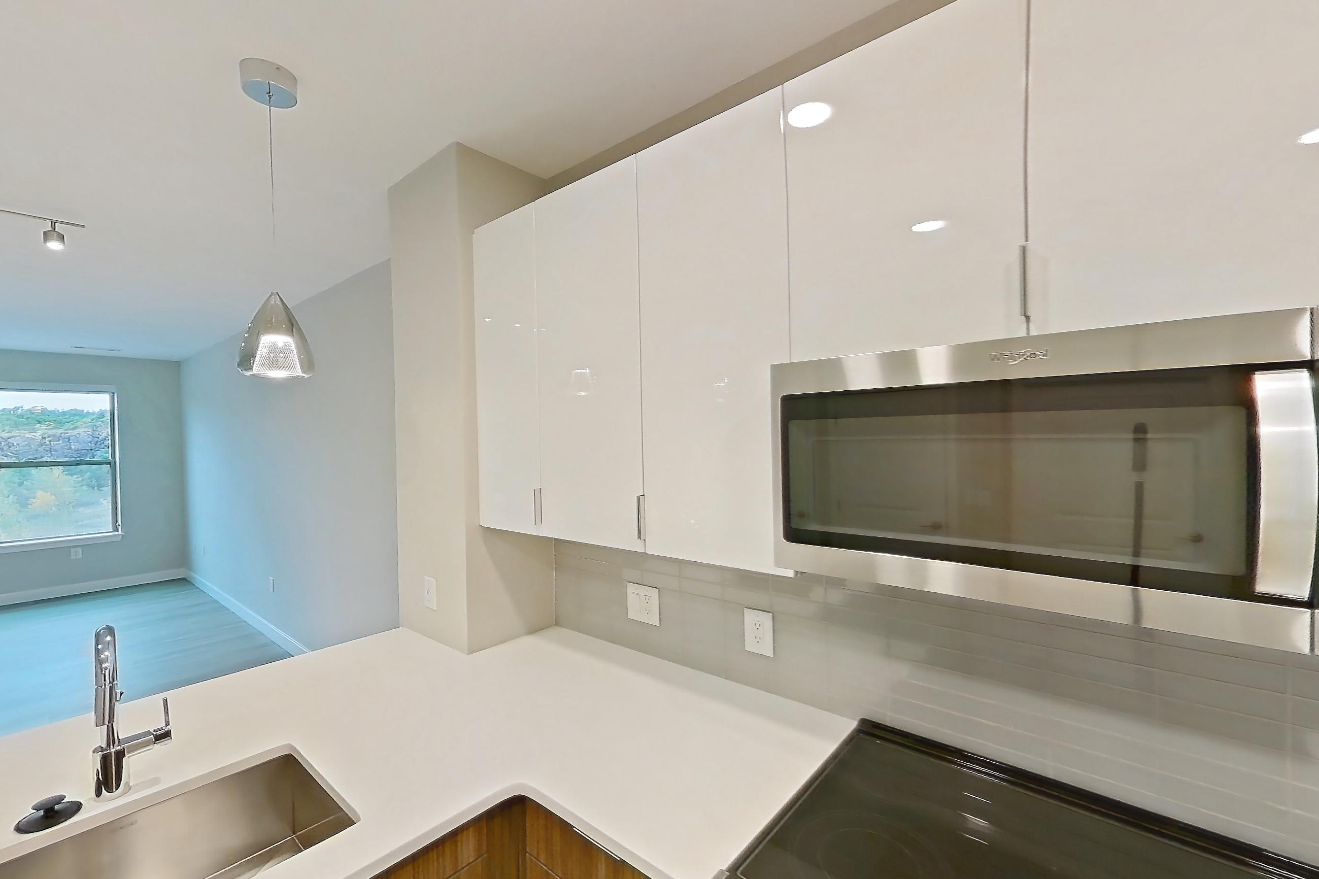Kitchen in Apartment em-7413 at The Emery at Overlook Ridge, A5 floor plan