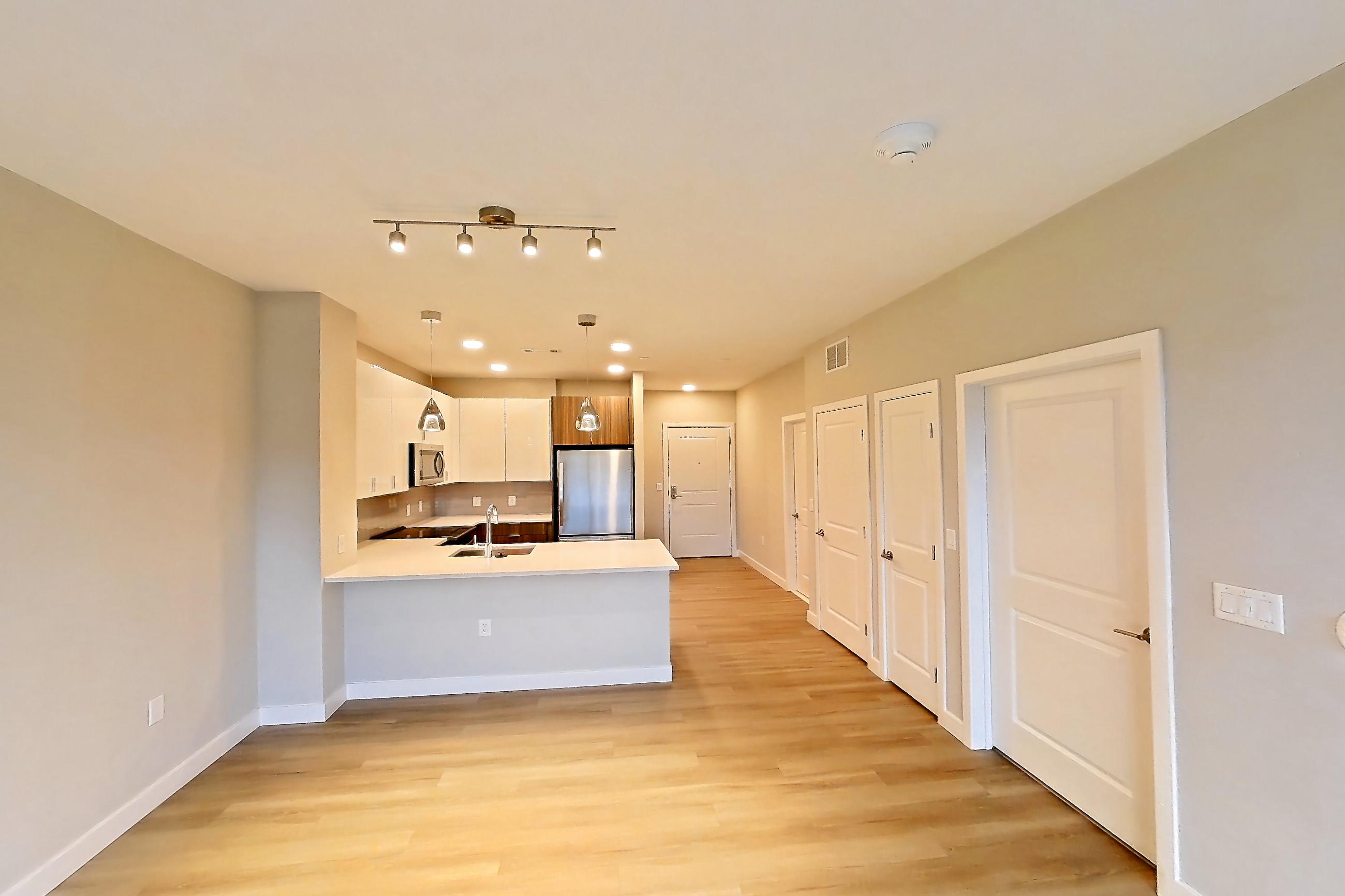 Living room in Apartment em-7413 at The Emery at Overlook Ridge, A5 floor plan