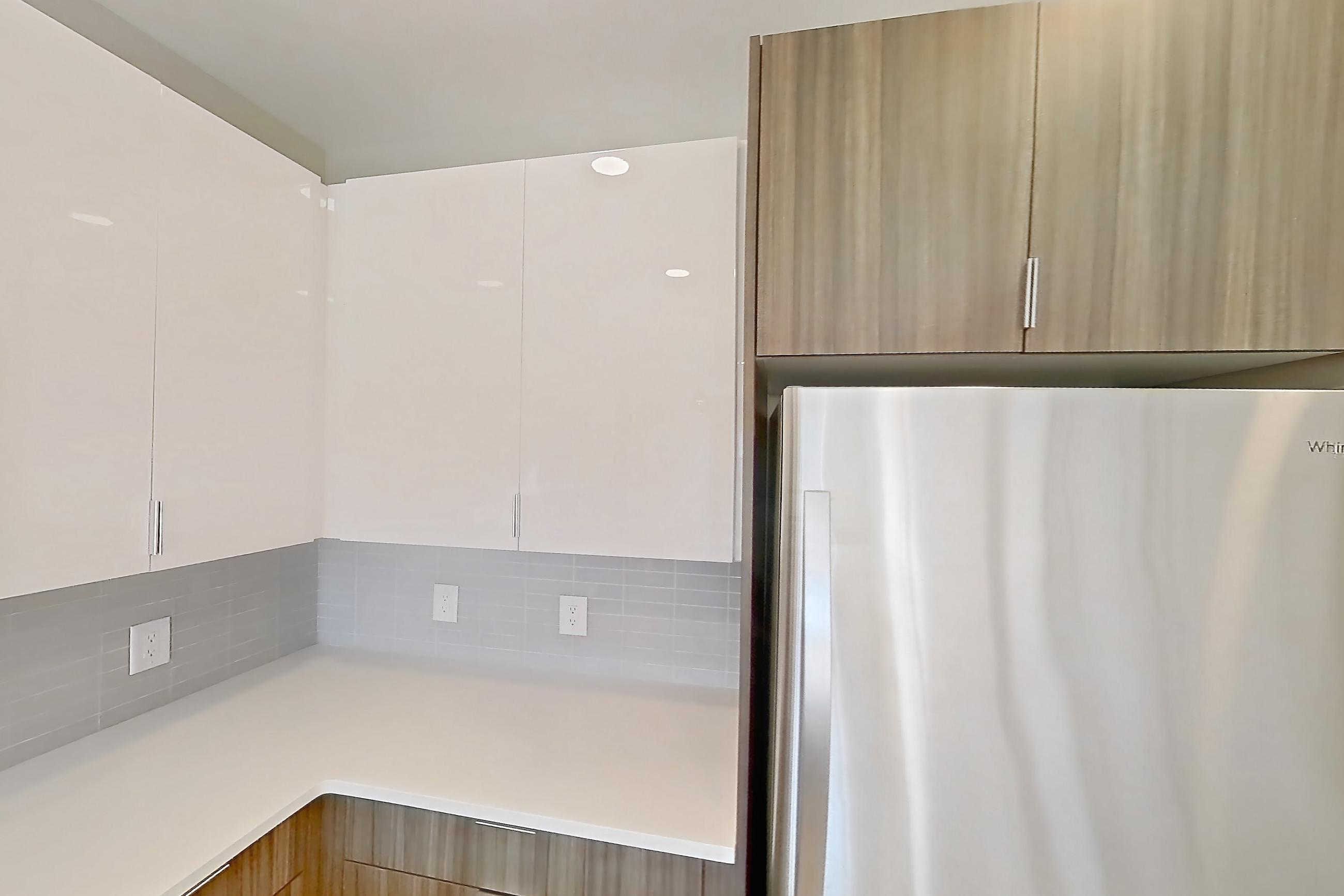 Kitchen in Apartment em-8415 at The Emery at Overlook Ridge, A3 floor plan