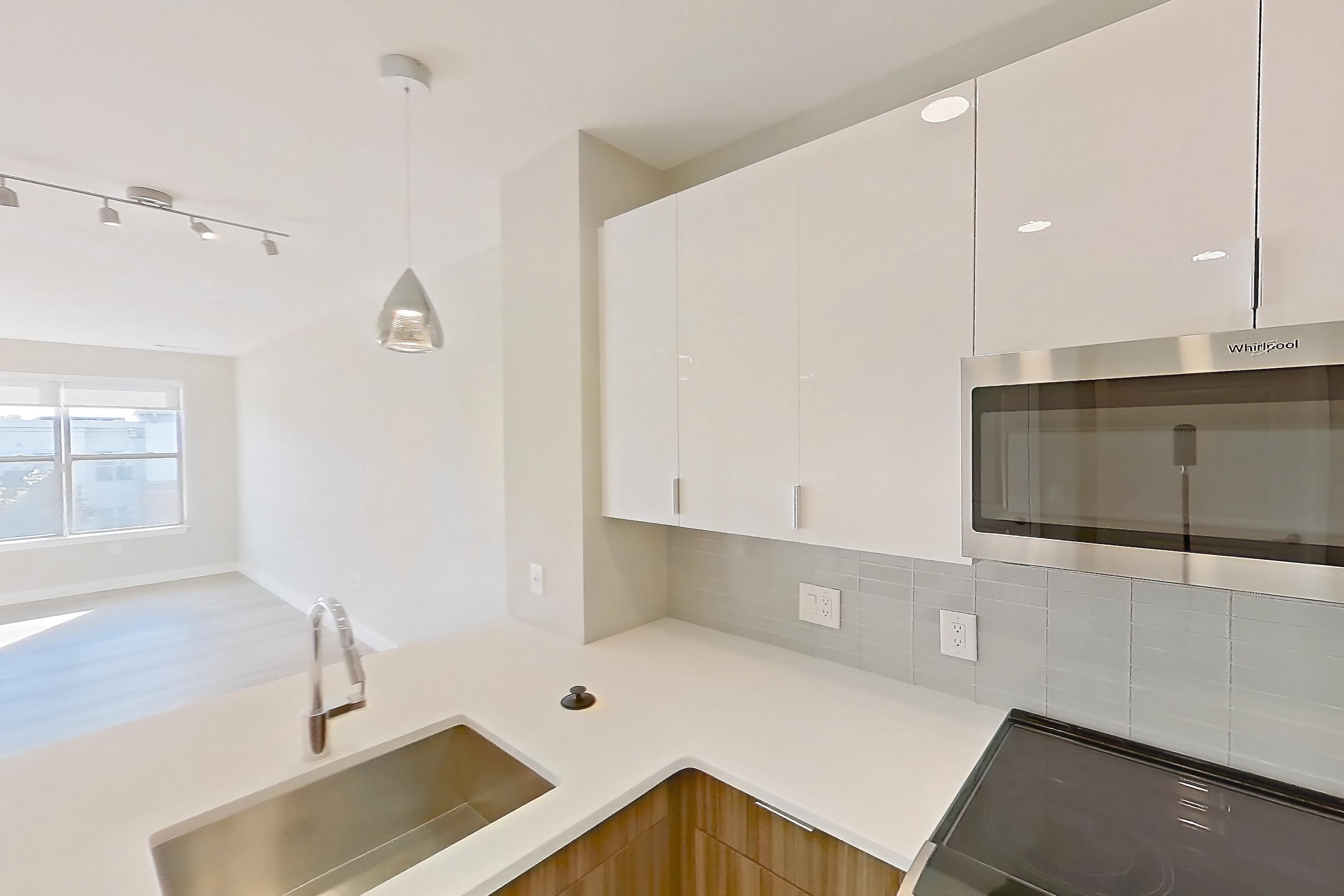 Kitchen in Apartment em-8415 at The Emery at Overlook Ridge, A3 floor plan