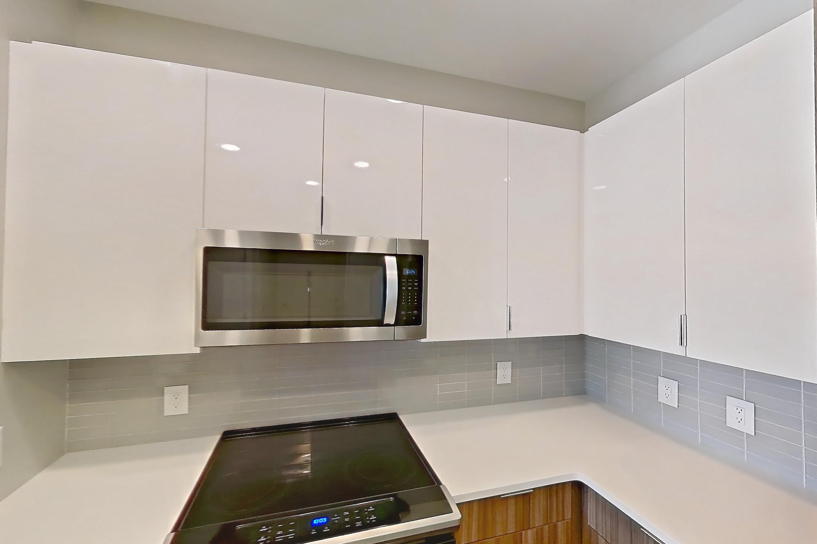 Kitchen in Apartment em-9504 at The Emery at Overlook Ridge, B1 floor plan