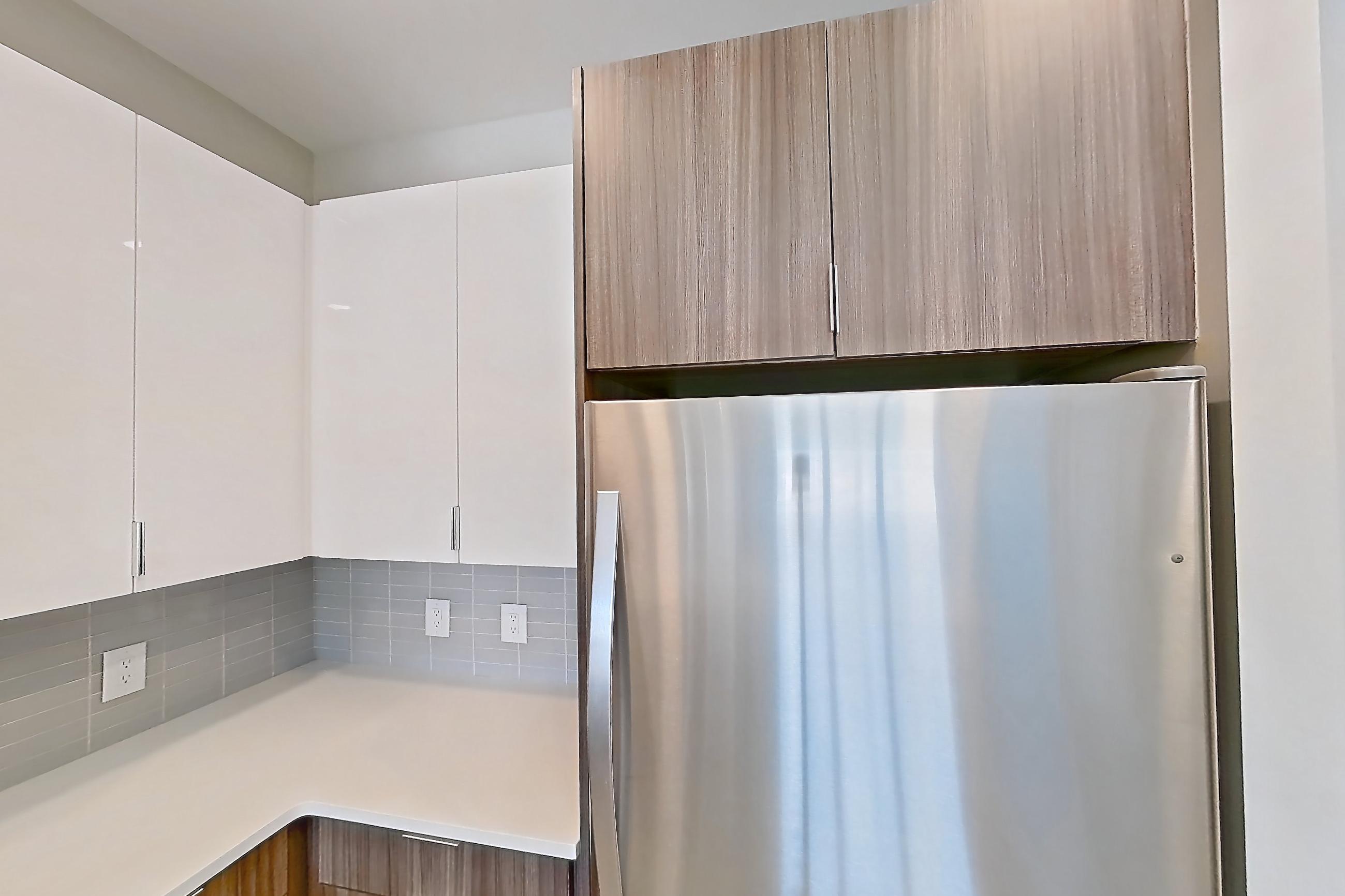 Kitchen in Apartment em-9504 at The Emery at Overlook Ridge, B1 floor plan