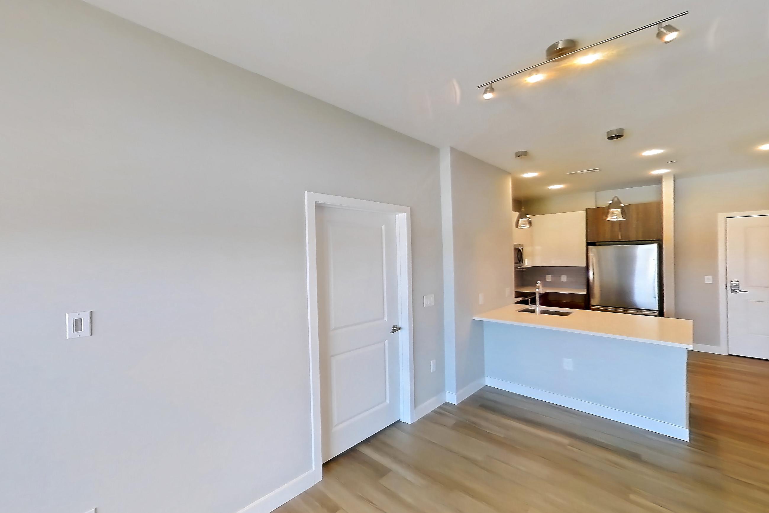 Living room in Apartment em-9504 at The Emery at Overlook Ridge, B1 floor plan
