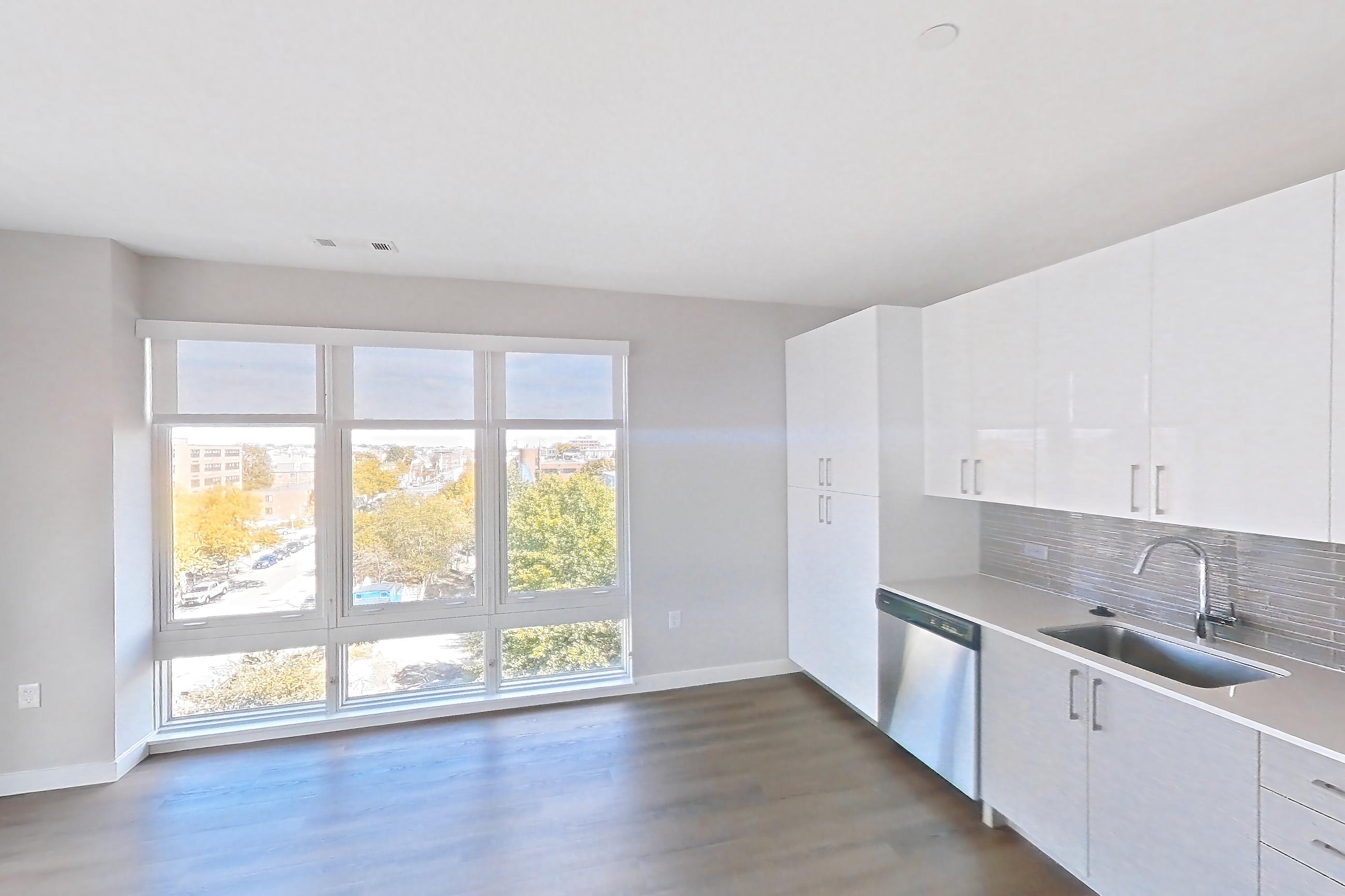 Living space in a 1 bd - 1 ba floor plan apartment, representative of Apartment PE2-2413 at Beacon Collection