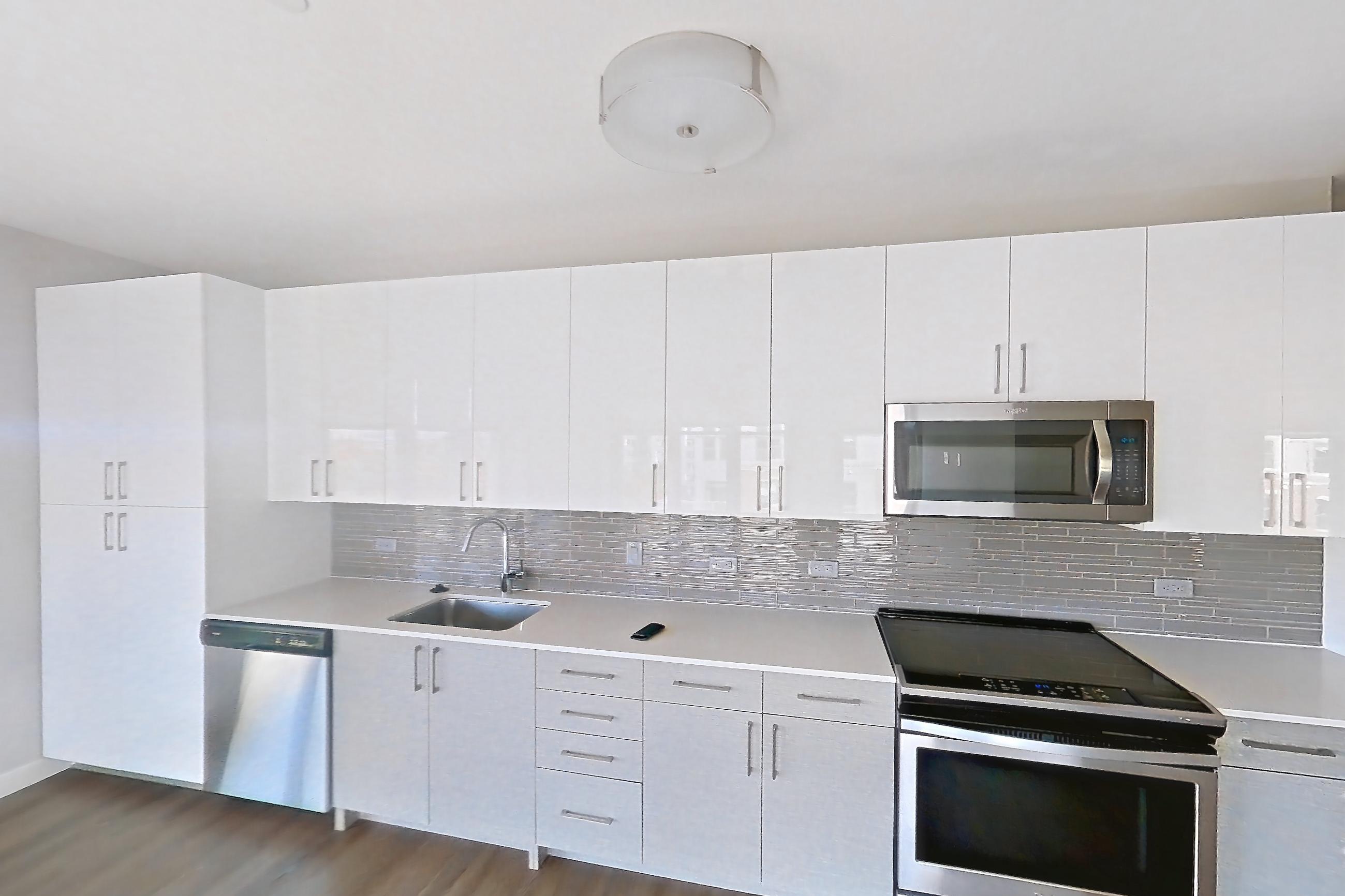 Living space in a 1 bd - 1 ba floor plan apartment, representative of Apartment PE2-2413 at Beacon Collection