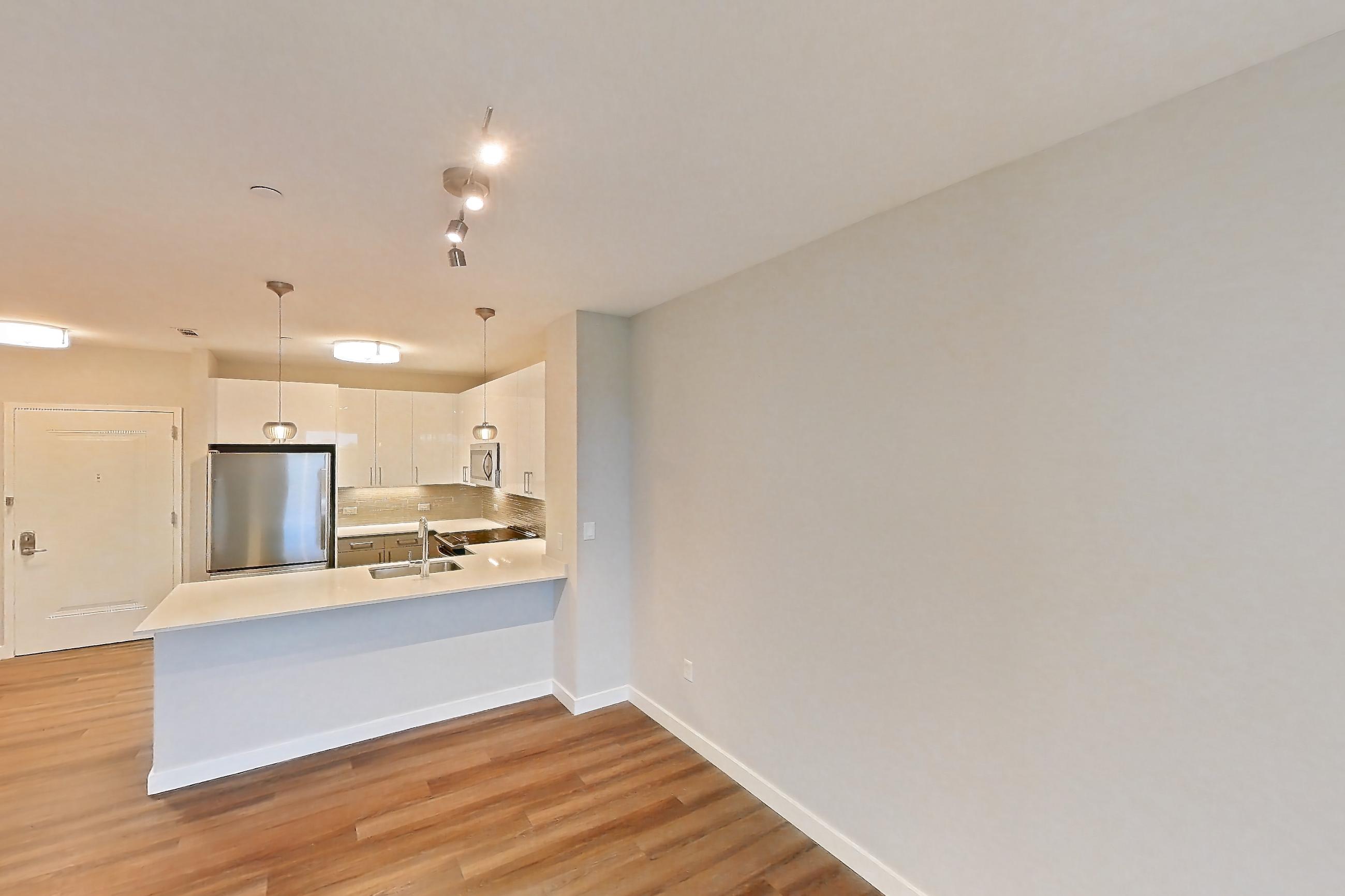 Living space with light wood-finish flooring, Apartment PE2-3419 at Beacon Collection